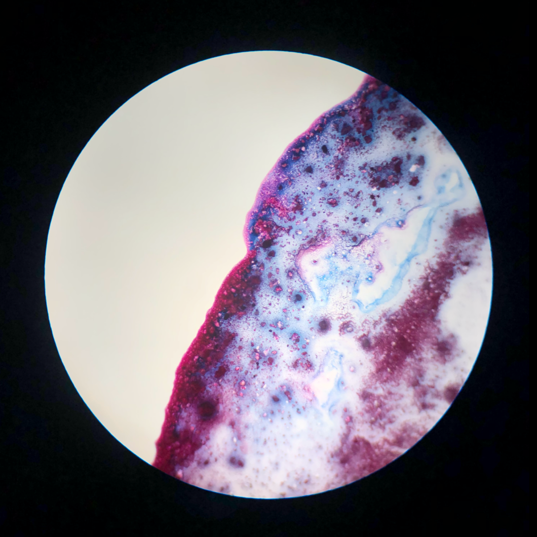 Mixing blue and pink watercolours; 10x objective