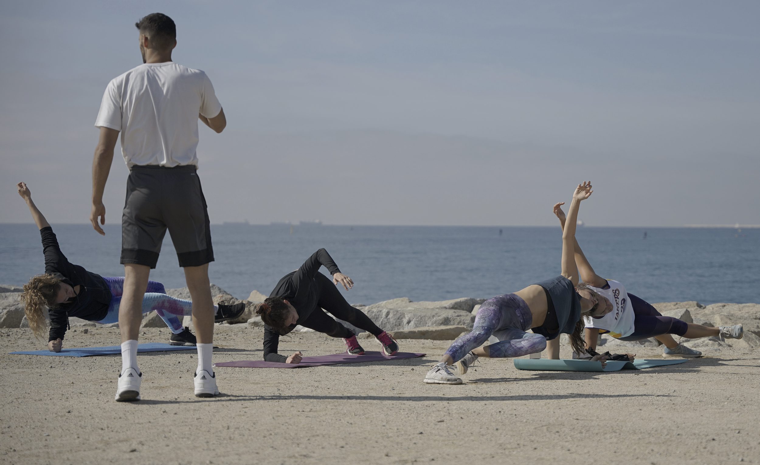 Group training session focused on strengthening, mobility, and pain relief, with options for indoor, outdoor, and online participation.