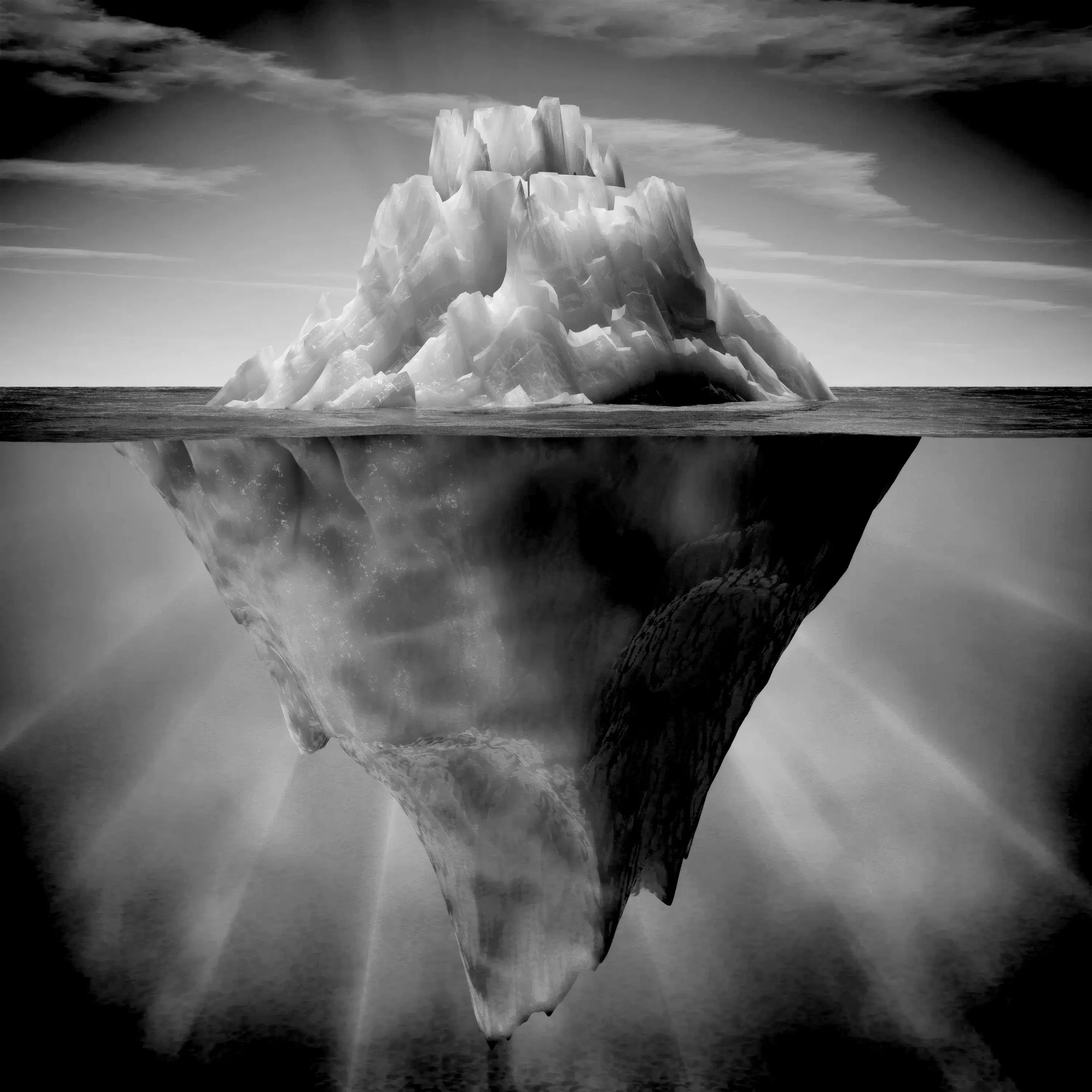 Image en noir et blanc d'un iceberg flottant, avec sa partie visible au-dessus de l'eau et sa partie immergée sous l'eau, montrant la grandeur de sa masse.