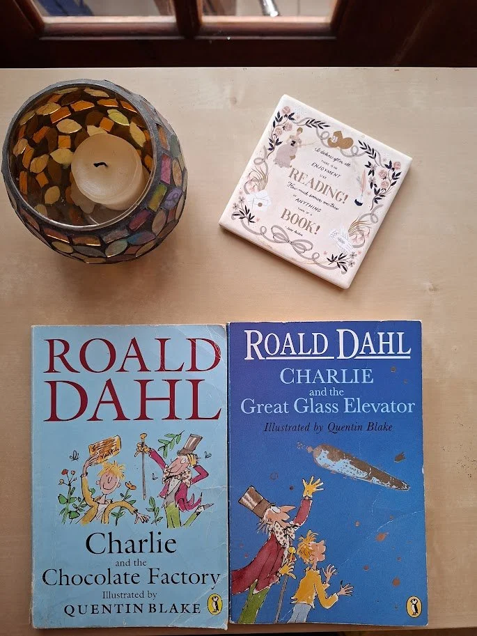 The front book covers of my original copy of Charlie and the Chocolate Factory next to a charity shop copy of Charlie and the Great Glass Elevator.