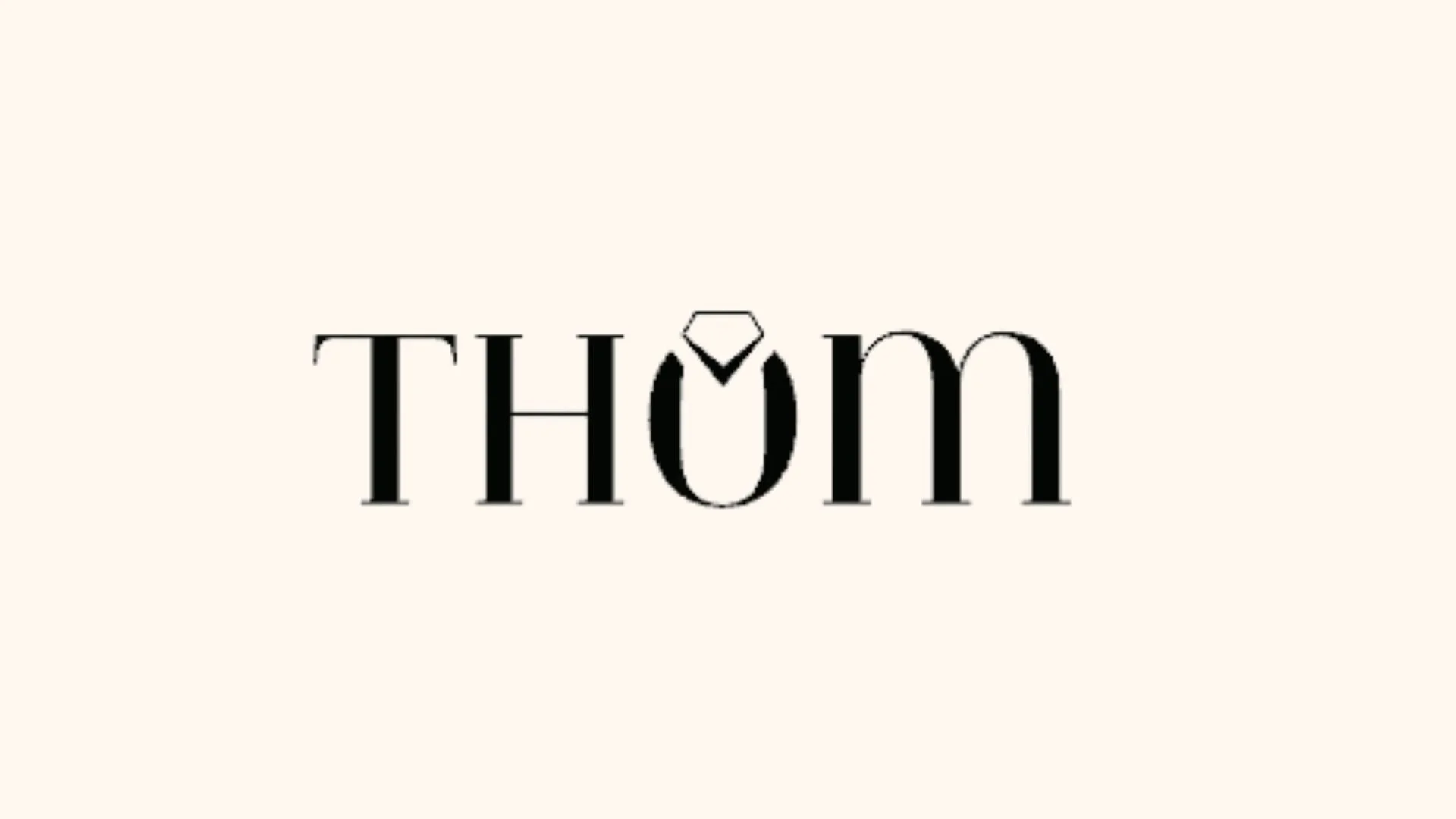 Logo avec le nom 'THÔN' en noir, dont le 'O' est stylisé en bague de diamant.