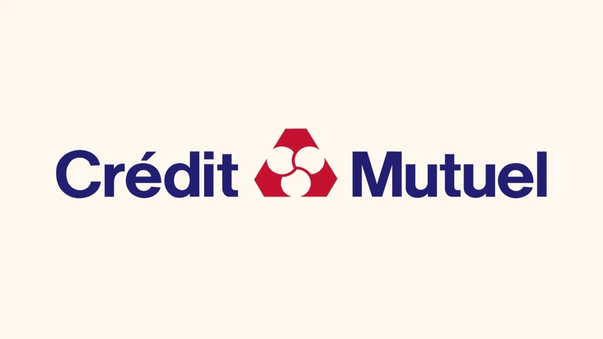 Logo de Crédit Mutuel avec le texte en bleu et un symbole rouge au centre.