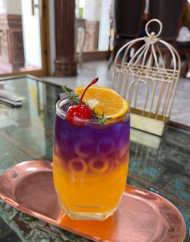 versailles-de-flore-signature-butterfly-pea-orange-mocktail.png
