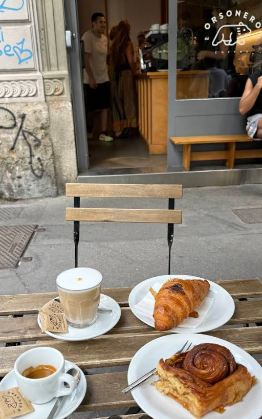 The-Drink-Journal-Orsonero-Coffee-Milan-outdoor-breakfast-table-latte-croissant-cinnamon-roll.png