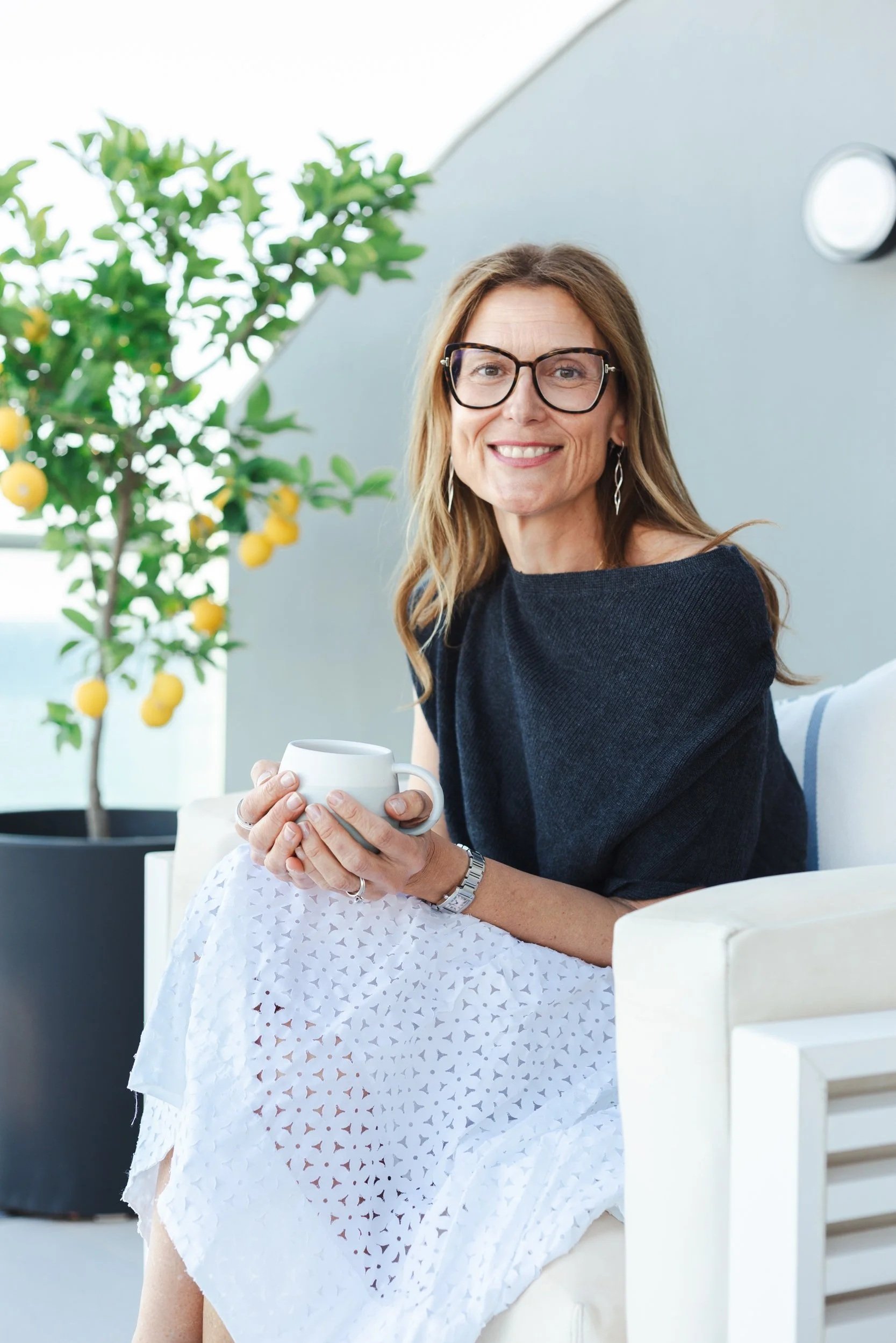 Wellbeing, healhy ageing, fit person in a relaxed environment in nature having a cup of tea