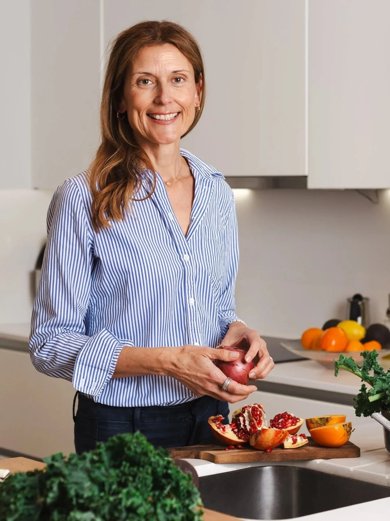 A health, happy woman smiling, relaxed and cooking nourishing food