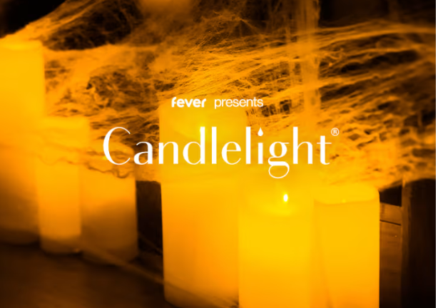 Multiple large LED candles emitting warm yellow light with smoke-like effects around them, advertising 'fever presents Candlelight' event.