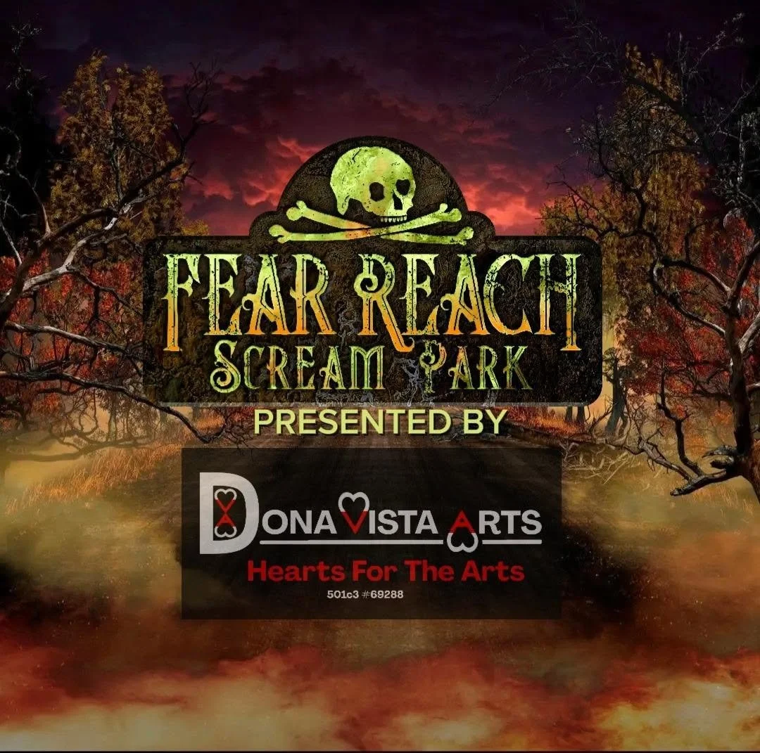 Dark autumn forest under a red and purple sky with a spooky sign promoting 'Fear Reach Scream Park,' featuring a skull and crossbones and sponsored by Dona Vista Arts, with the tagline 'Hearts For The Arts'.