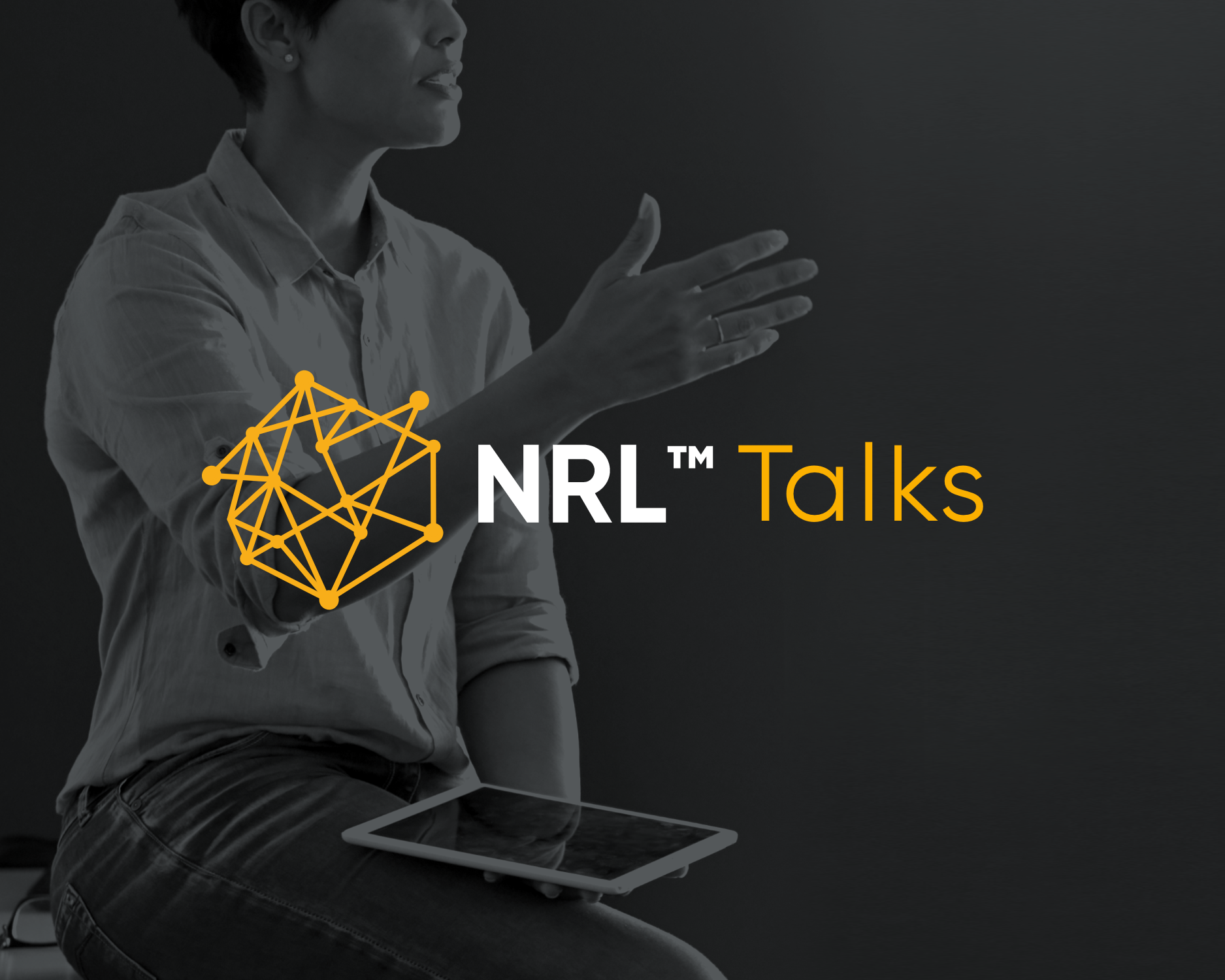 A woman sitting with a tablet on her lap, gesturing with her right hand. Text overlay reads 'NRL™ Talks' with a geometric orange network icon.
