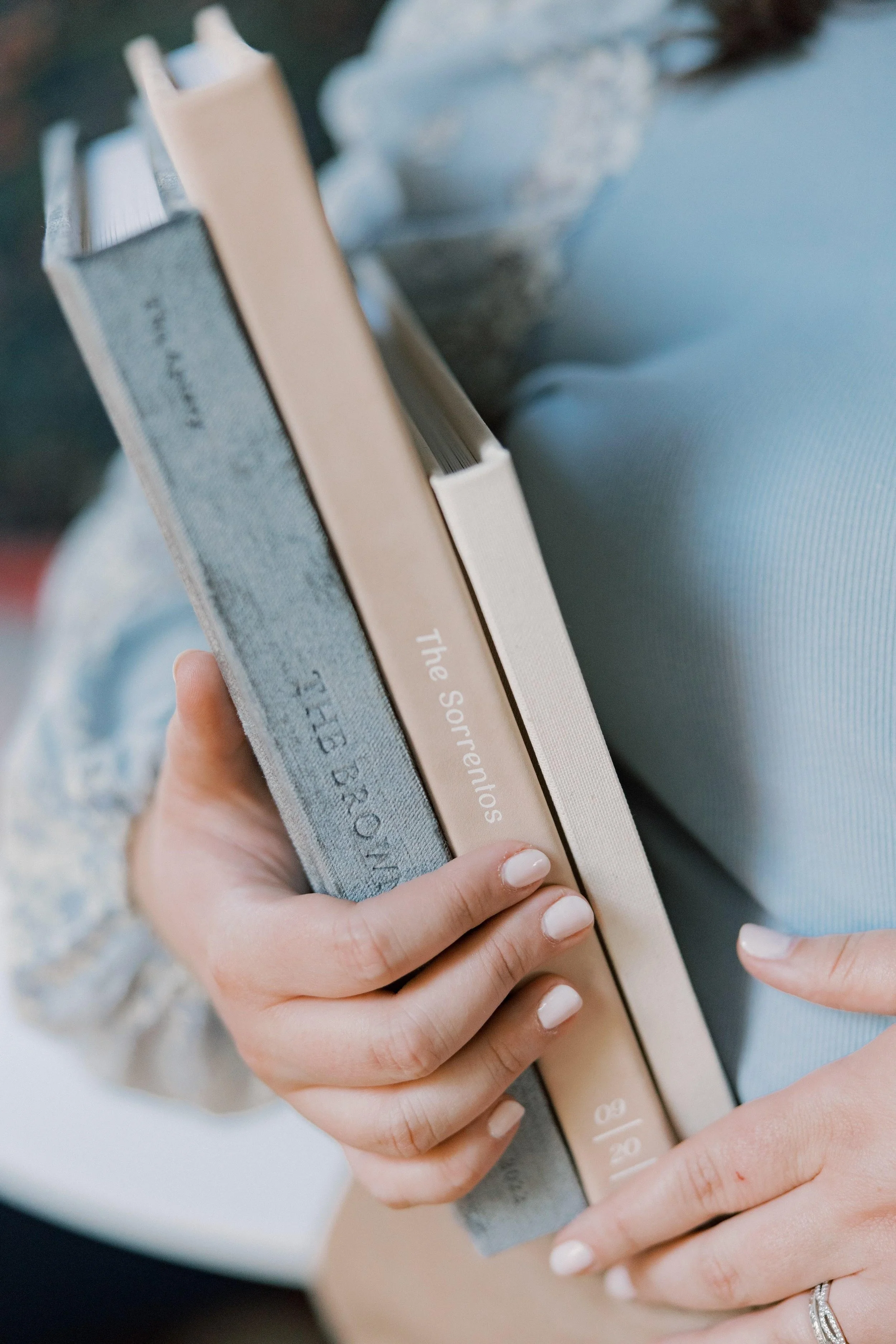 Close up of spines of wedding albums.