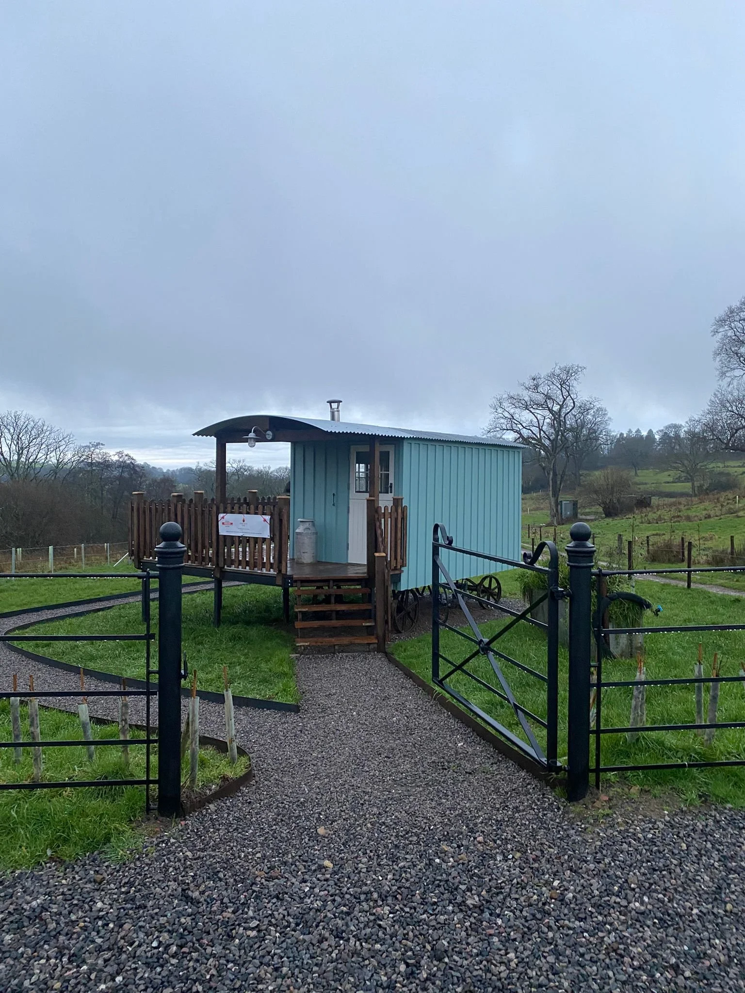 Blue shepherds hut in beautiful green rolling hills. 