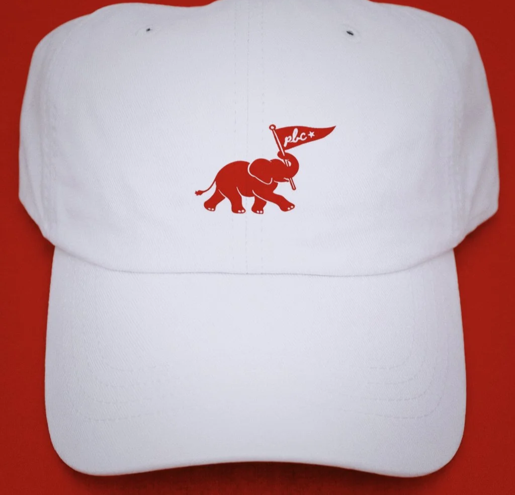 White baseball cap with PBC elephant logo embroidered in red stitching