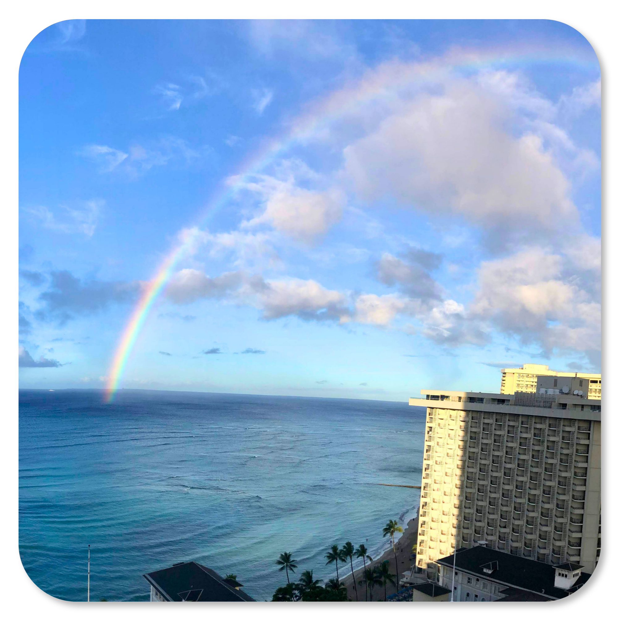 A beautiful Hawaiian rainbow over Waikiki's coastline and the Pacific Ocean.