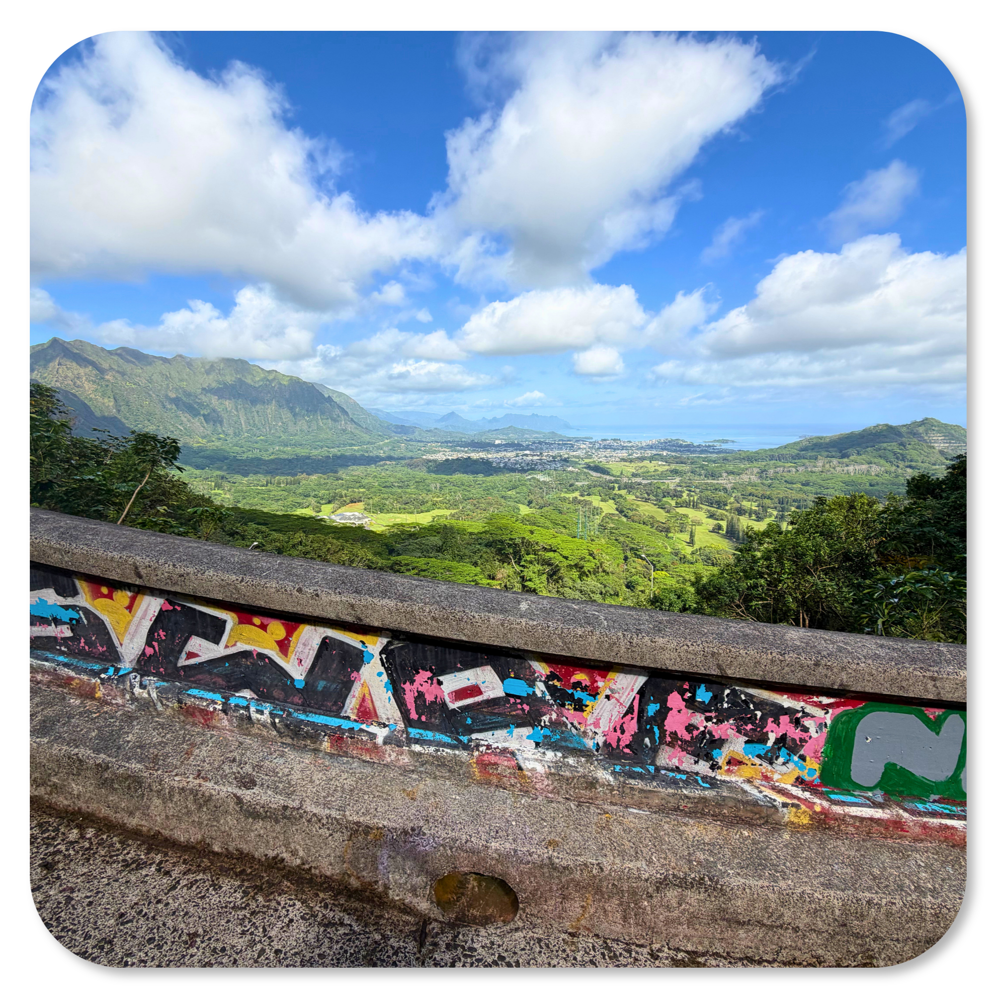 Sweeping views from Nuʻuanu Pali Lookout across Oahu's lush Koʻolau Mountains and Windward coastline.