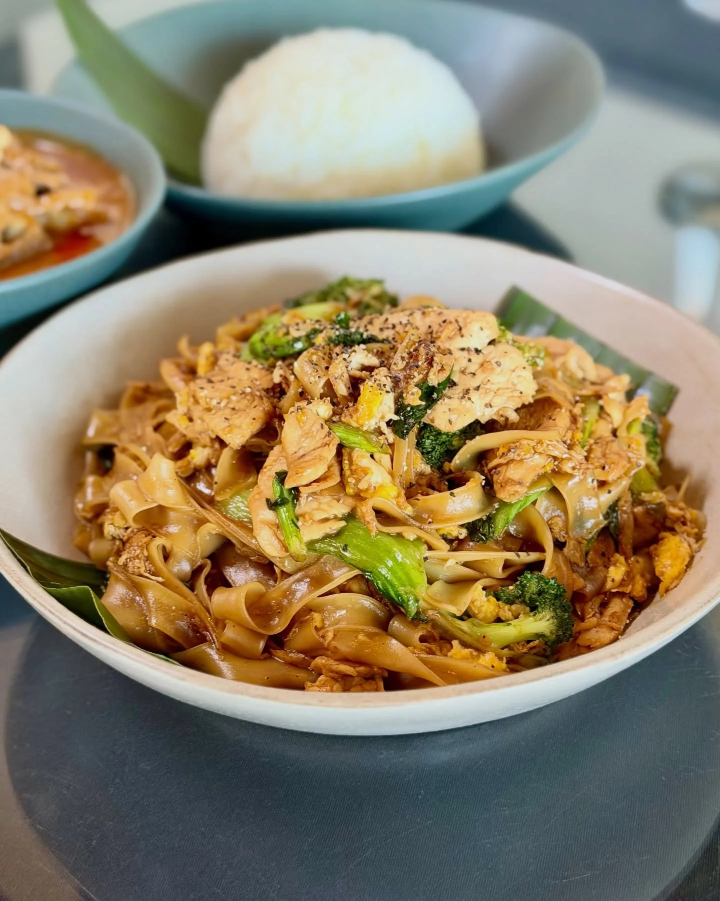 Pad See Ew kind of Friday. 🍜
Wide rice noodles, wok-seared with egg, Chinese broccoli, and savory soy sauce. Comforting, bold, and always the move to start the weekend.

Dine in or take it to go.

#PadSeeEw #FridayEats #KansasCityFood