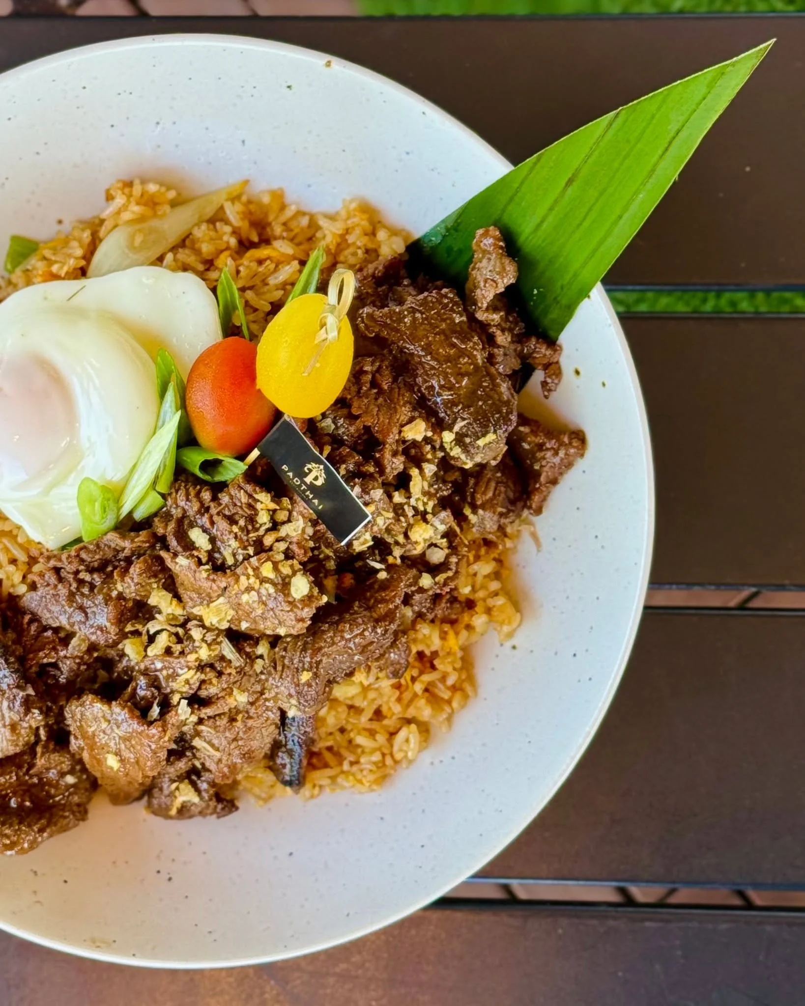 Our Tiger Cry Fried Rice started as a favorite appetizer&hellip; and guests kept asking for more. So we turned it into a full meal.

Marinated thin slices of beef, grilled and laid over a bed of savory fried rice, finished with a perfectly runny over