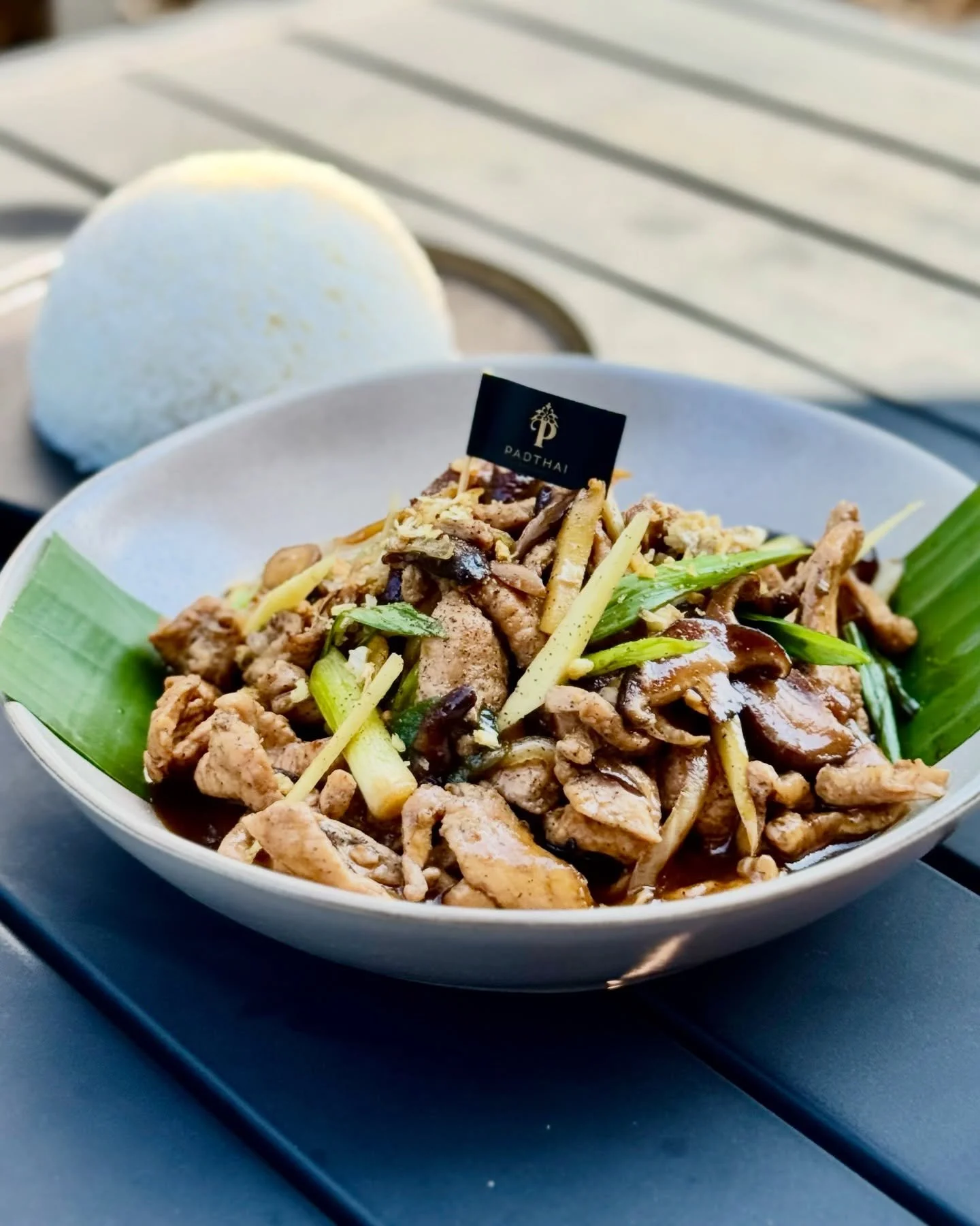 Royal Thai Chicken 👑

Garlic and rum marinated chicken, wok-tossed with shiitake mushrooms and fresh ginger in a savory garlic sauce. Bold, aromatic, and full of comforting Thai flavor.

Served delicious with fragrant jasmine rice to soak up every l