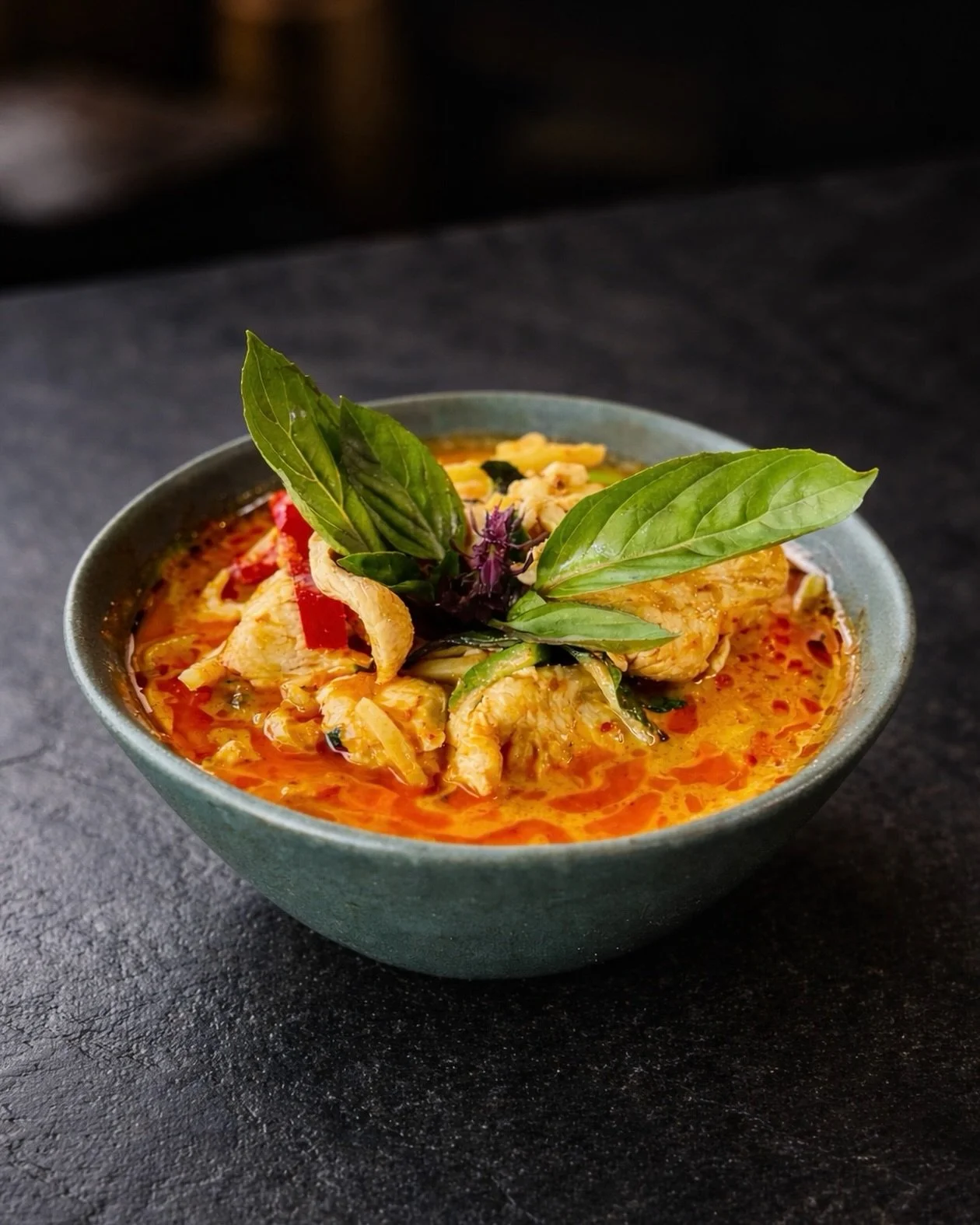 Craving something rich this Sunday?

Thai red curry traces its roots to central Thailand, built on a paste of dried red chilies, garlic, lemongrass, galangal, and spices, slowly cooked into coconut milk until it turns bold, aromatic, and deeply layer
