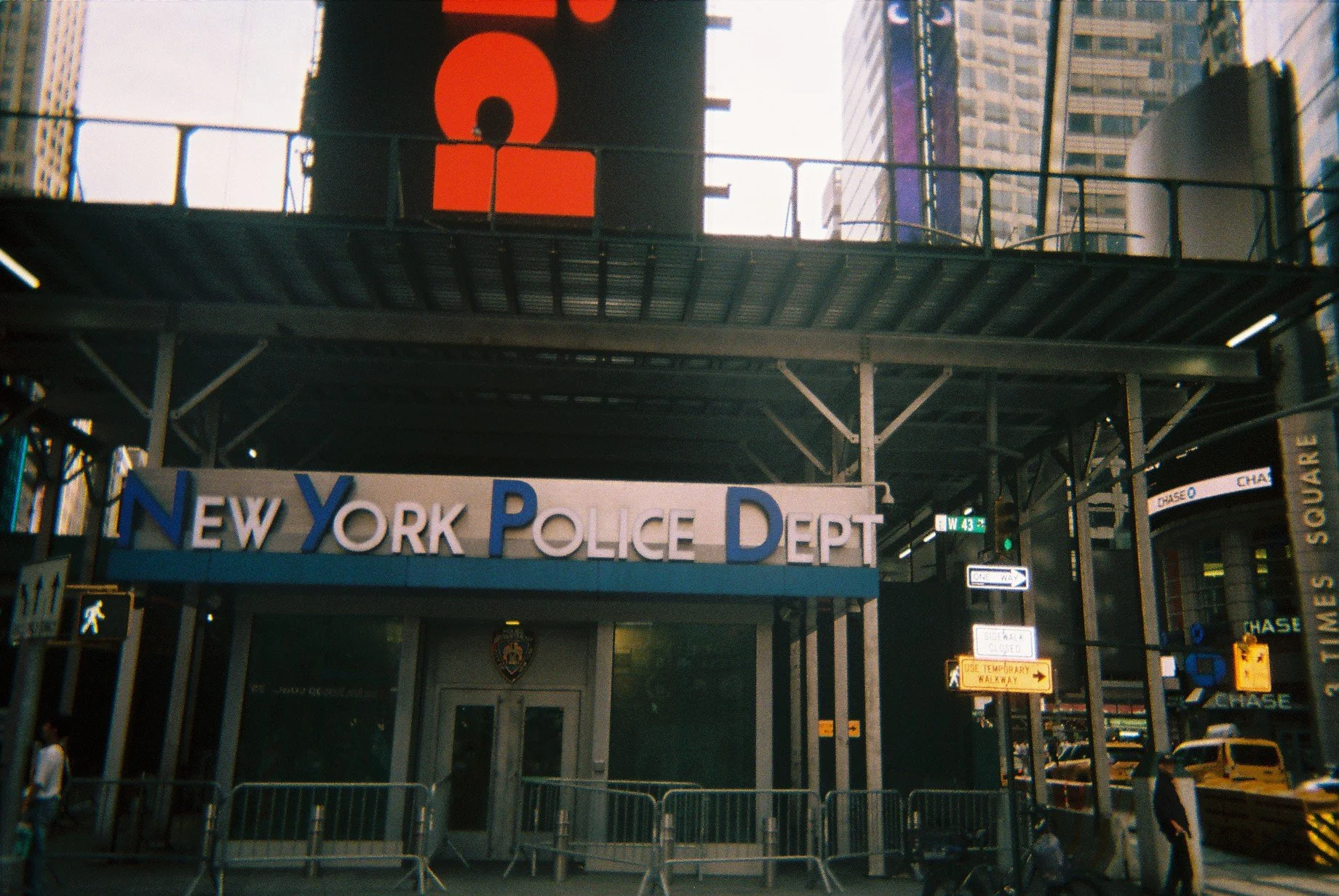 Entrance to the New York Police Department headquarters in New York City, with a sign displaying 