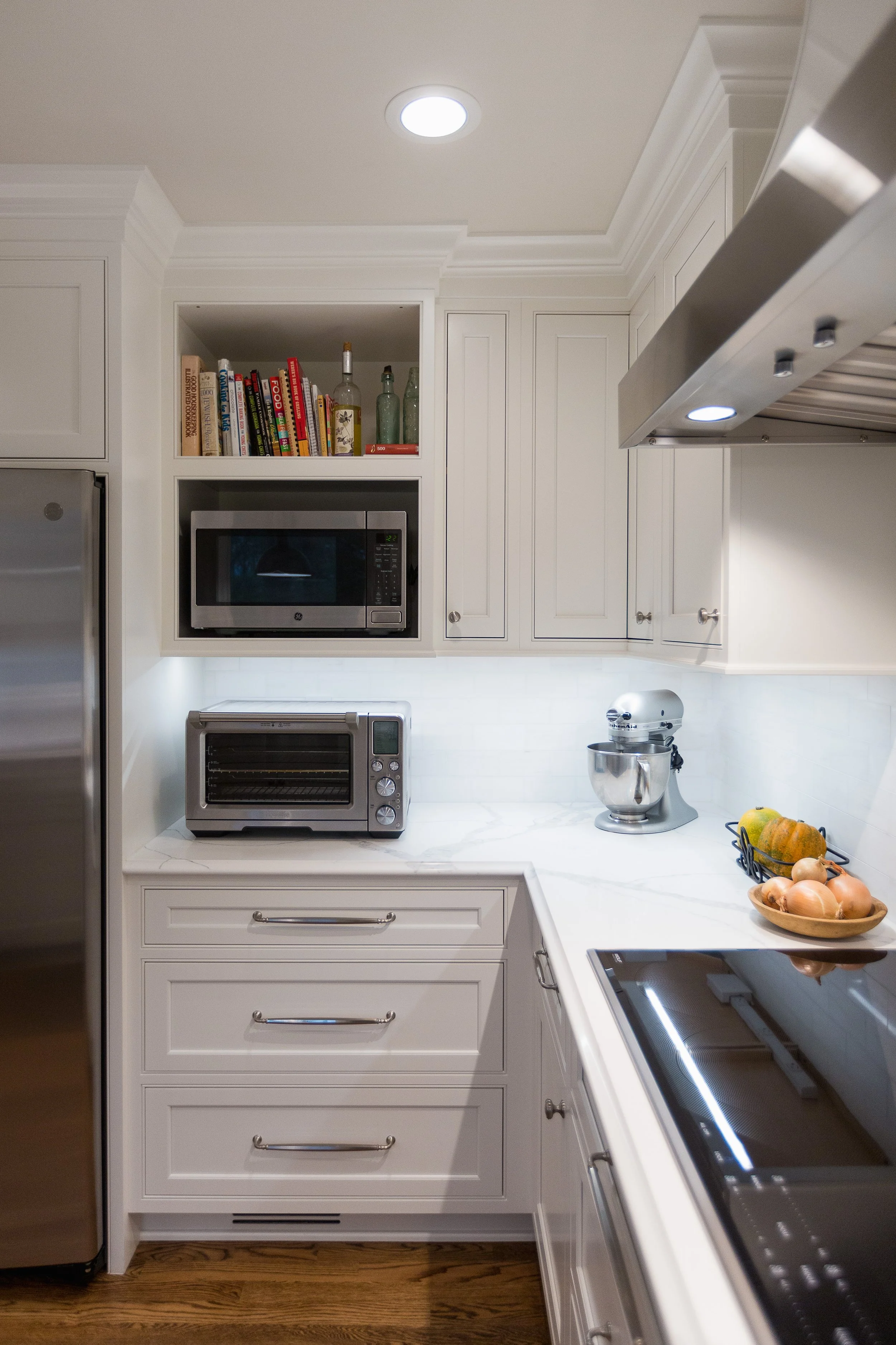 Nook for Cookbooks.  Microwave Hidden behind Refrigerator