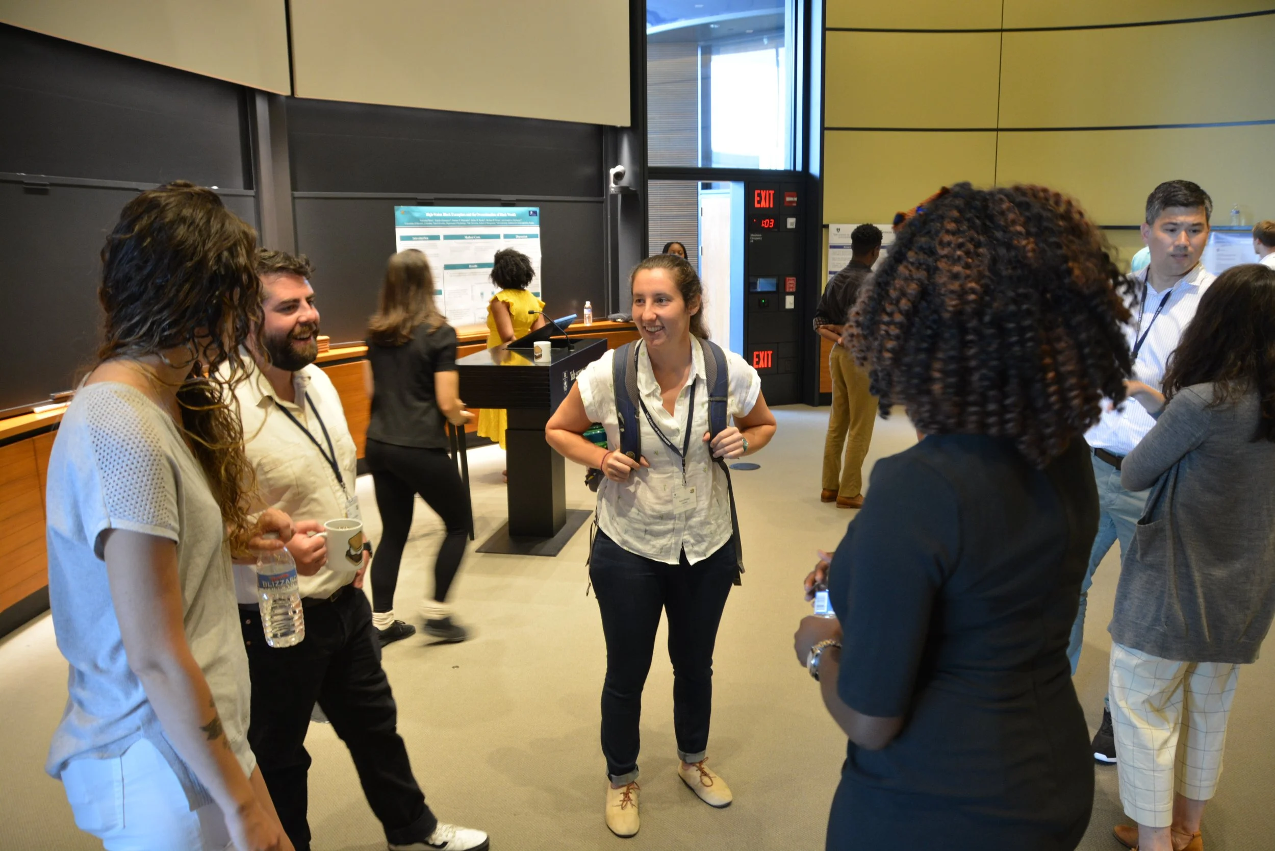 A group of scholars takes part in our summer training program research presentation meeting