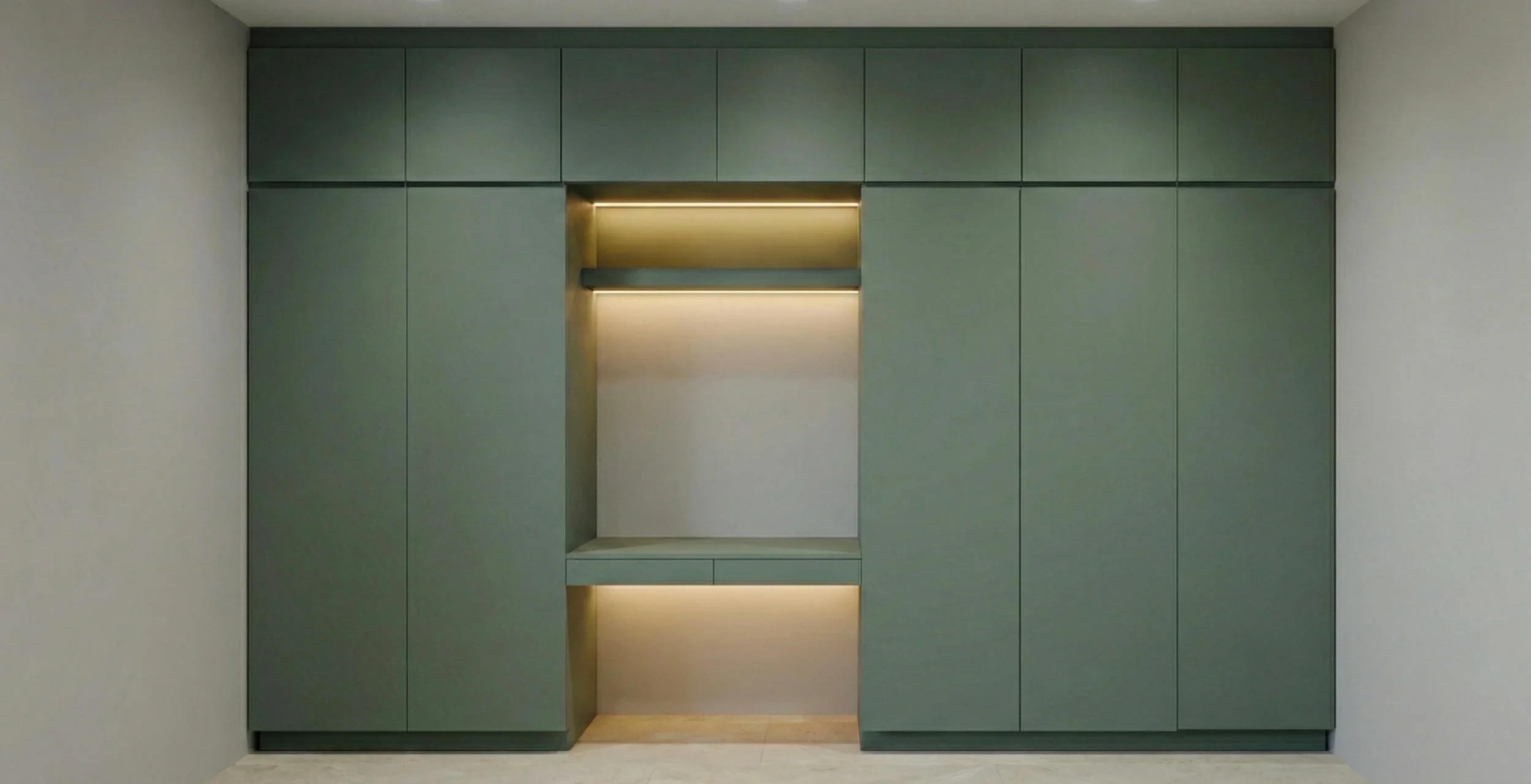 Clóset empotrado de diseño minimalista en color verde mate, "Edición Romero" de Estudio Madera. Integra una estación de trabajo (home office) con iluminación LED cálida, bajo el concepto de "Orden Silencioso" y optimización inteligente del espacio.