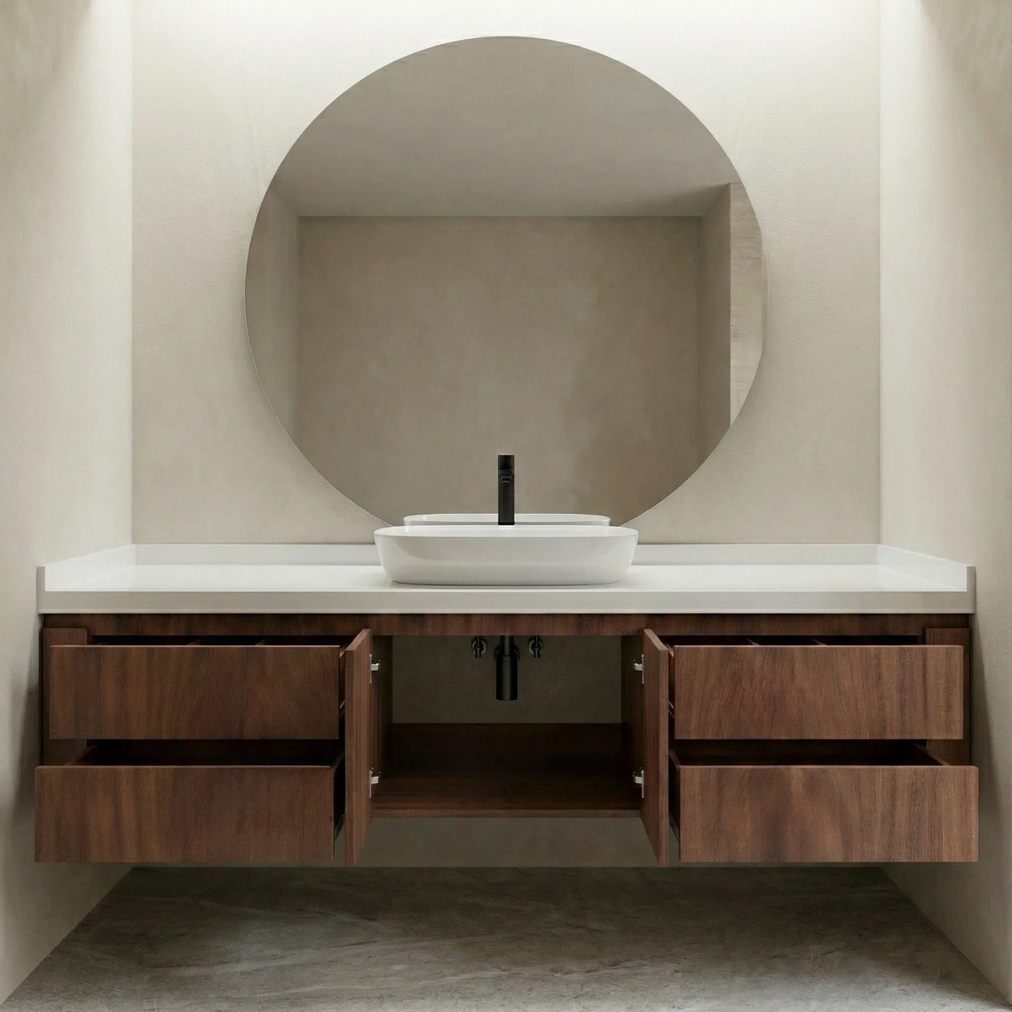 Mueble de baño suspendido "Edición Orgánica" de Estudio Madera, fabricado en madera sólida de Tzalam con cubierta de superficie sólida blanca. Un diseño de minimalismo cálido con espejo circular que proyecta lujo esencial y calma visual.