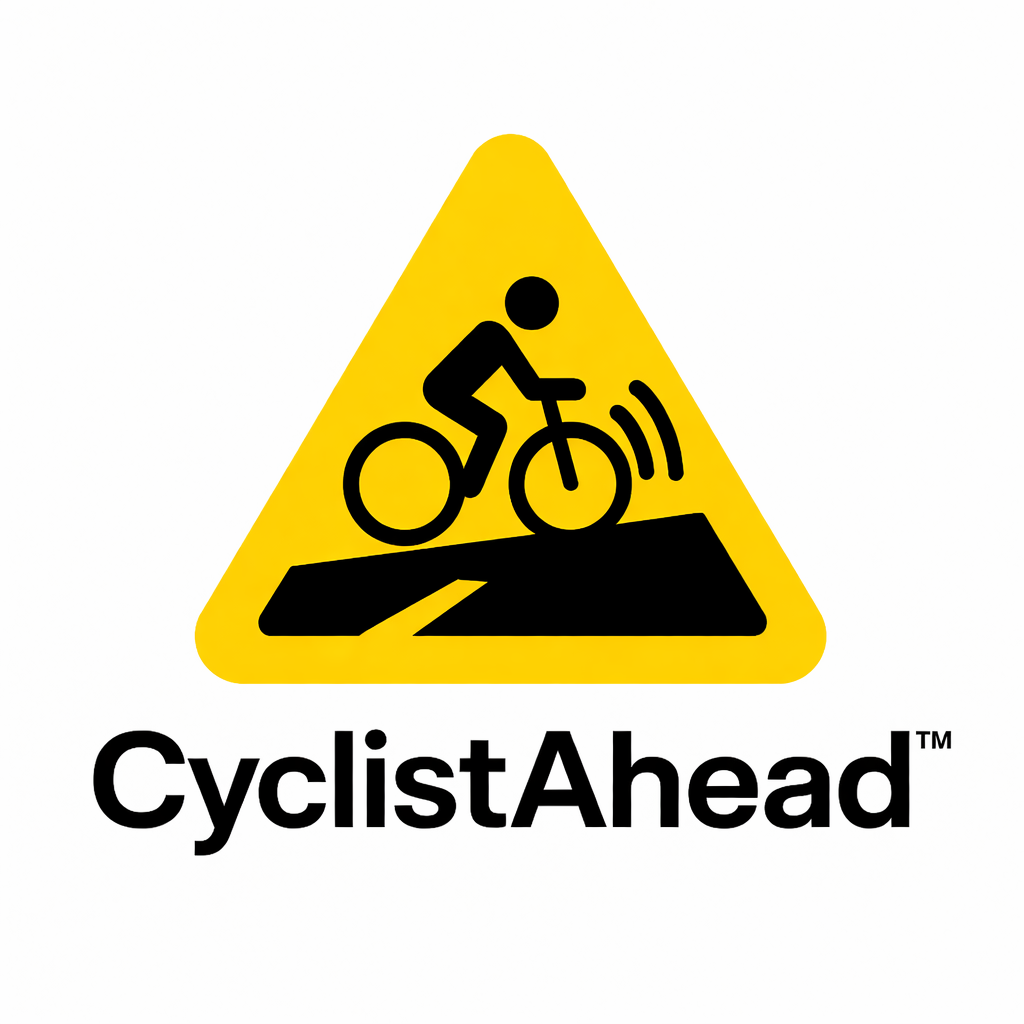 A yellow warning sign with a black silhouette of a cyclist riding over a rough road with vibrations. Below the sign is the text "CyclistAhead."