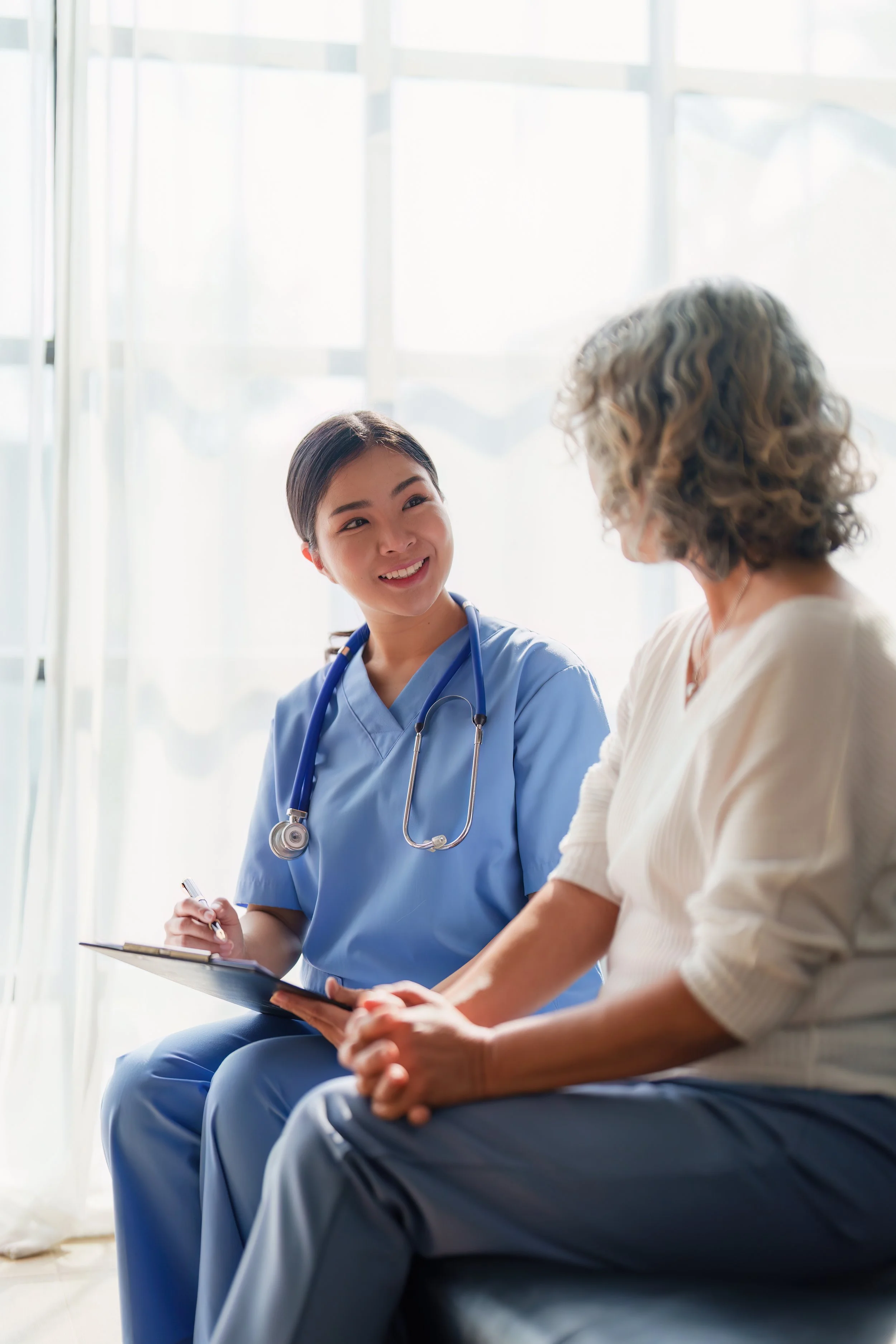 Clinician talking with patient in TXM MicroHospital exam room