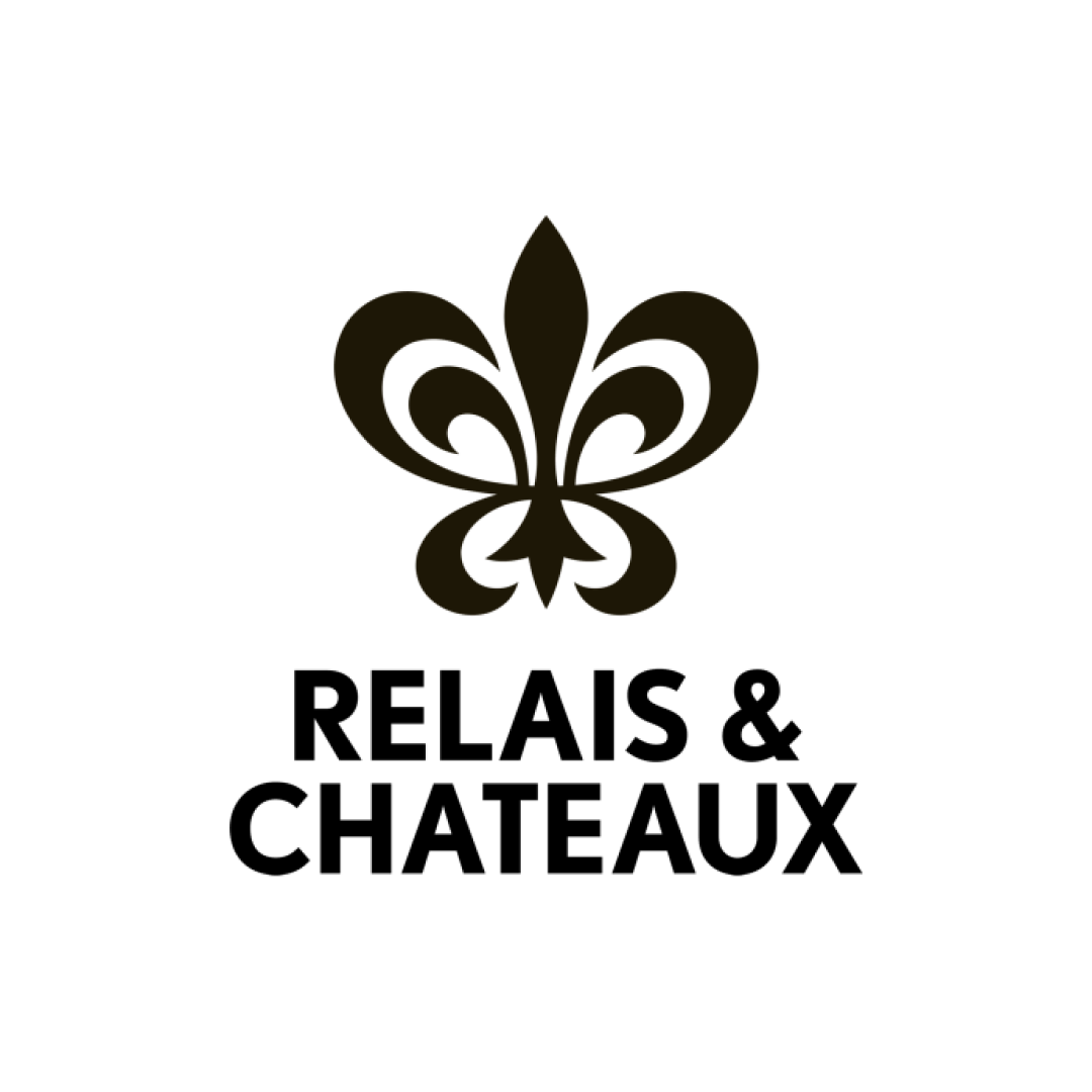 Black logo with gold fleur-de-lis design and golden text 'Soaring Eagle Business Coaching'