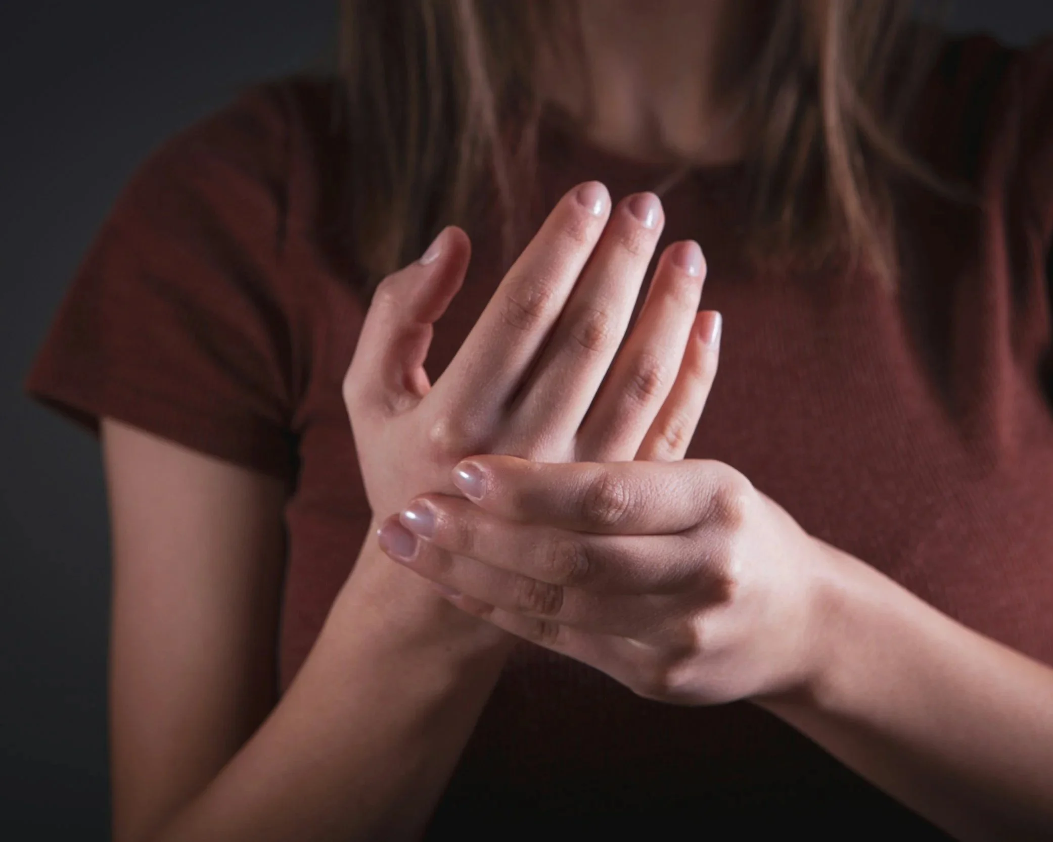 Worker with repetitive strain wrist pain from job duties