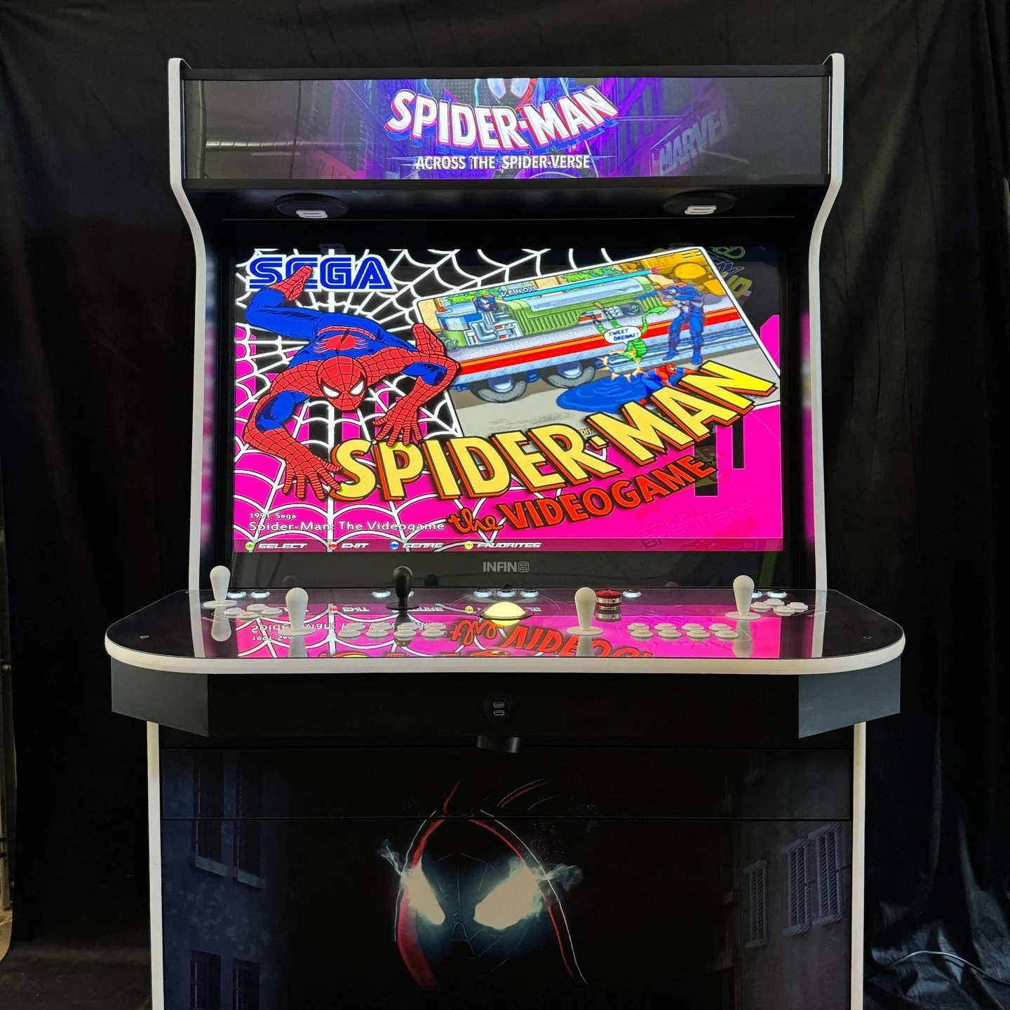 A fighting arcade game machine with a colorful screen, control buttons, and joysticks, featuring characters and the phrase 'Let's Fight' displayed on the top.