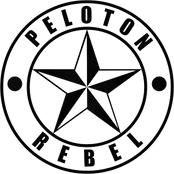 Black and white logo featuring a compass rose and the words 'PELOTON' and 'REBEL' in a circular layout