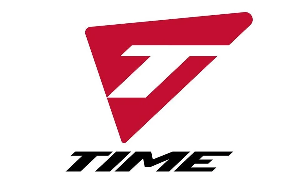 Logo with a red triangular shape containing a stylized white 'Z' and the word 'TIME' in bold black letters underneath.