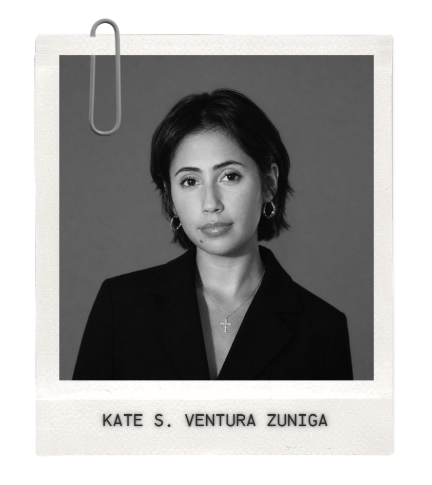 A black and white portrait of a woman with short dark hair, wearing earrings, a necklace with a cross pendant, and a blazer, looking directly at the camera. The name "Kate S. Ventura Zuniga" is written at the bottom.