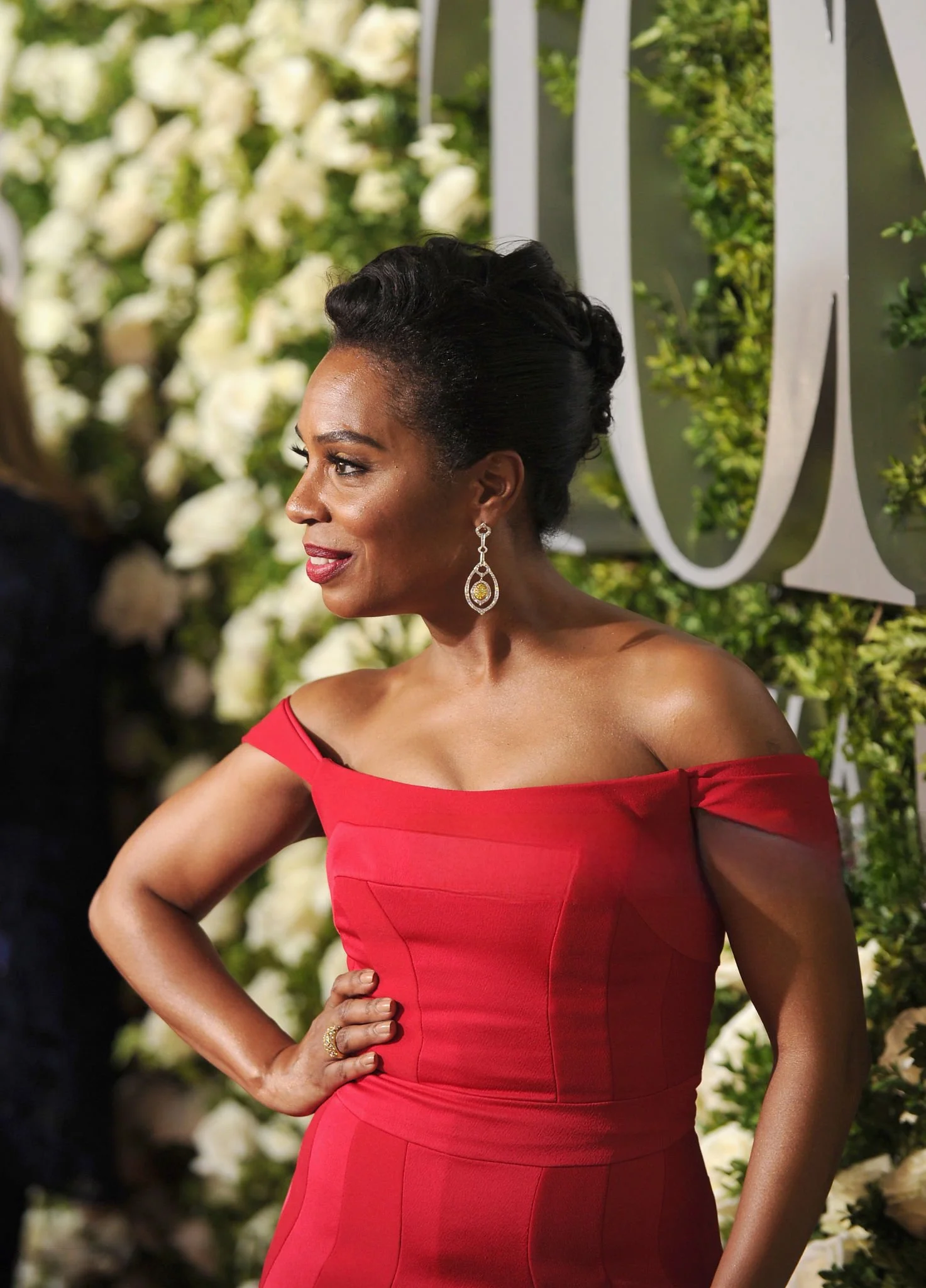 Close-up of actress Michelle Wilson at the Tony Awards, wearing Gumuchian diamond earrings and ring, styled by Chandra Moore.