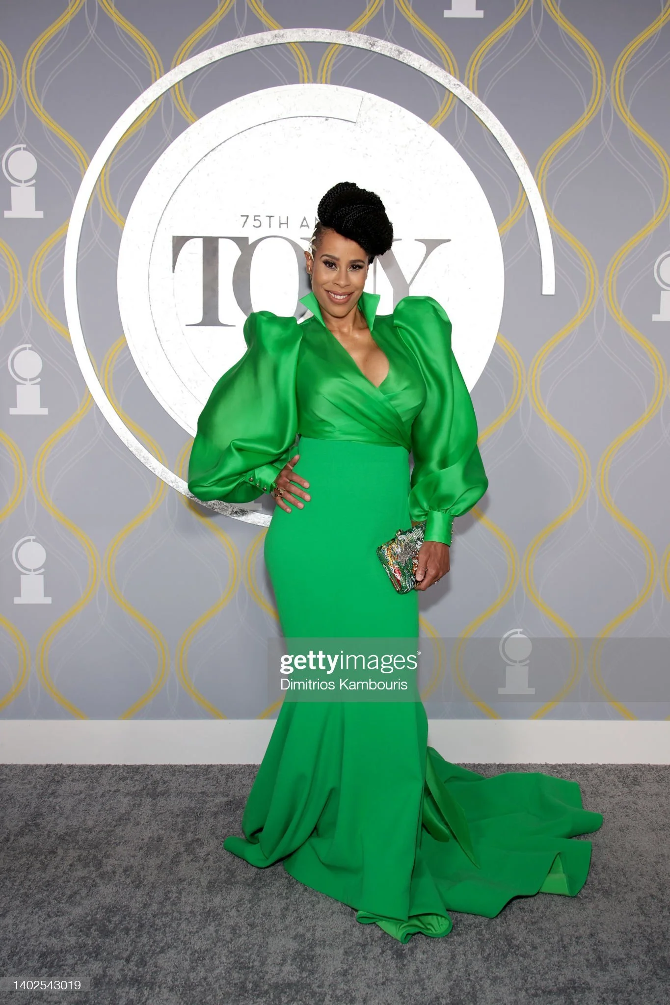 Dominique Morisseau on the red carpet at the 75th annual Tony Awards, wearing a bright green gown, styled by Chandra Moore.