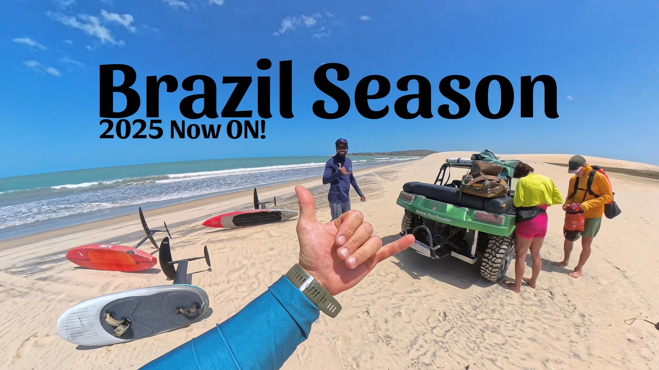 A promotional photo of a beach with sand and waves, featuring three people preparing gear including paddleboards and a golf cart. One person in a blue shirt is pointing at the camera, another in a yellow shirt and pink shorts is packing items into the cart, and a third person in an orange jacket is standing nearby. The sky is clear and blue. Text on the image reads "Brazil Season 2025 Now ON!".