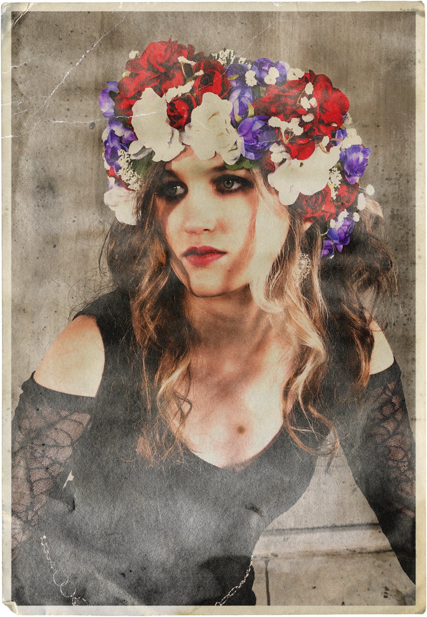 Quinn from Freeze The Fall wearing a black dress with lace cutouts on the shoulders. She has a flower crown made of red, white, and purple flowers and dark eye makeup.