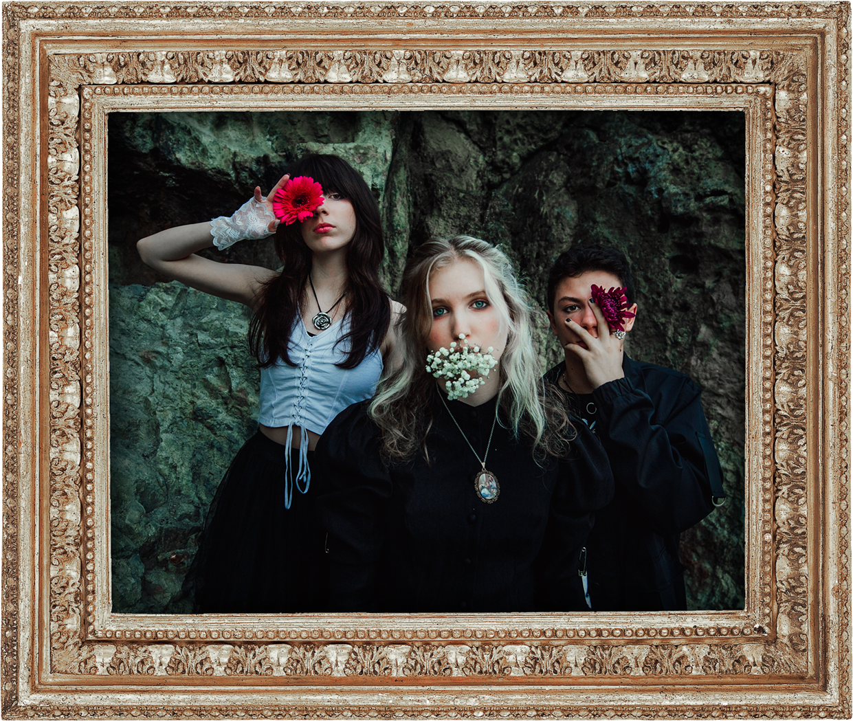Freeze The Fall posing in front of a rocky background, framed by an ornate gold frame. Each band member holds a flower over their face or in front of their face.