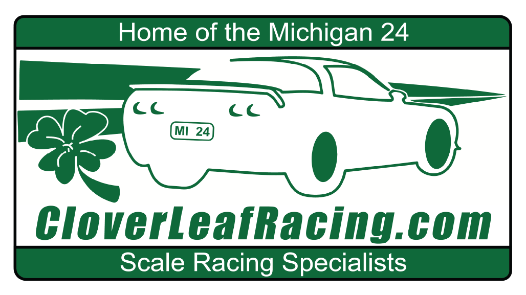 A green and white sign featuring a racing car with a shamrock and the text 'Home of the Michigan 24.' The website 'CloverLeafRacing.com' and the phrase 'Scale Racing Specialists' are also present.