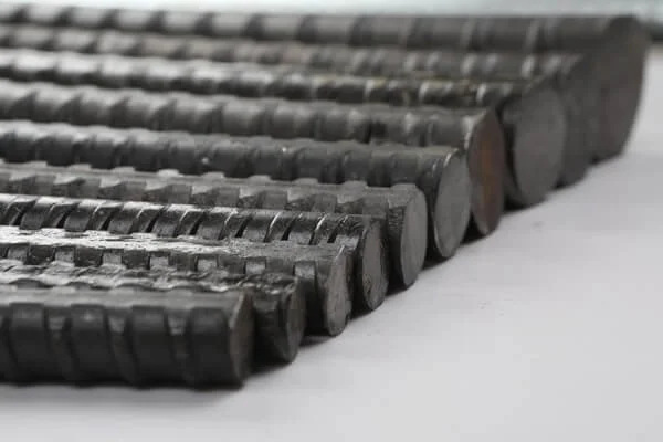 Close-up of black metal screws arranged in rows.