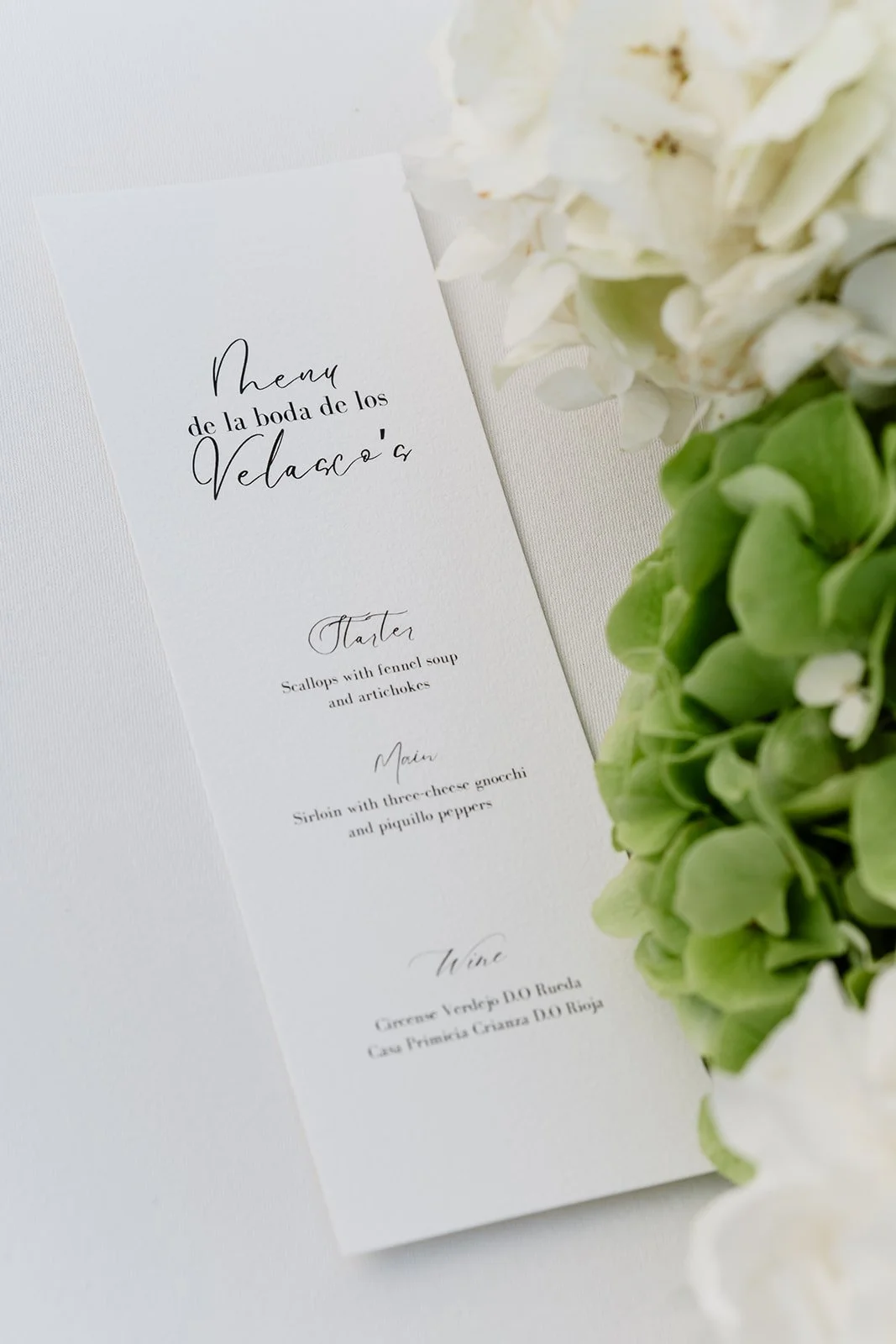 Minimalist wedding menu design with refined typography and soft floral details