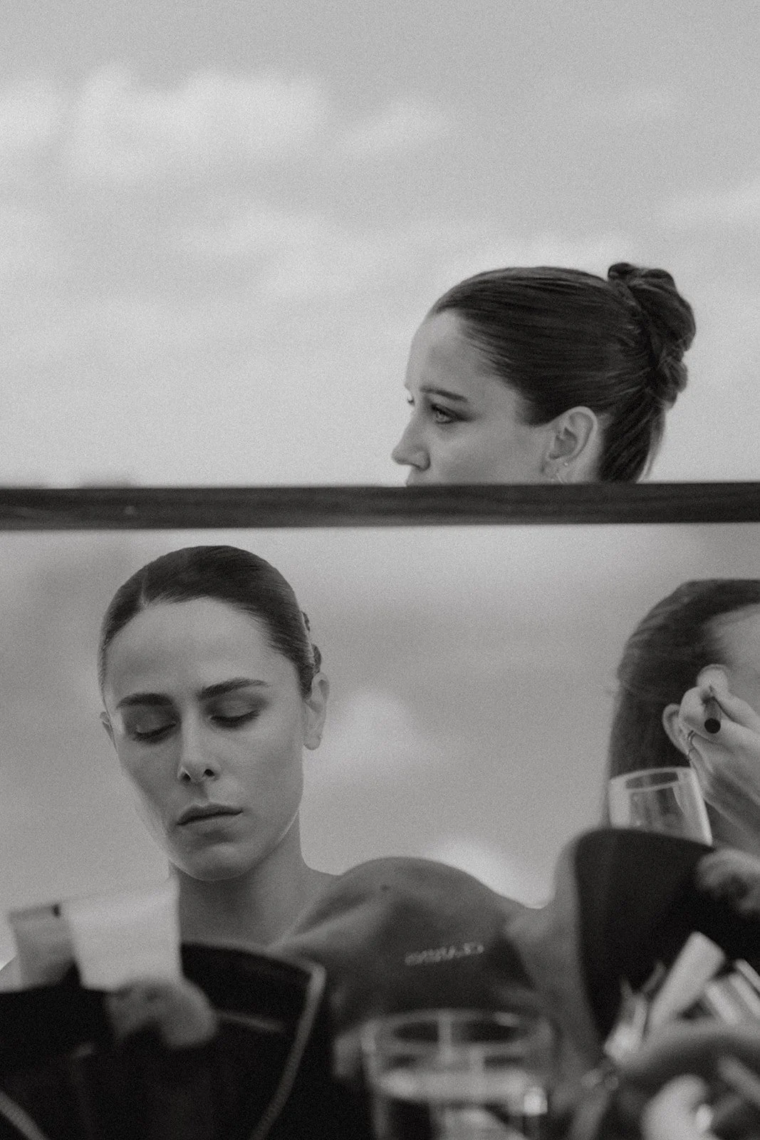 Bride getting ready seen through mirror reflections during wedding morning in Menorca