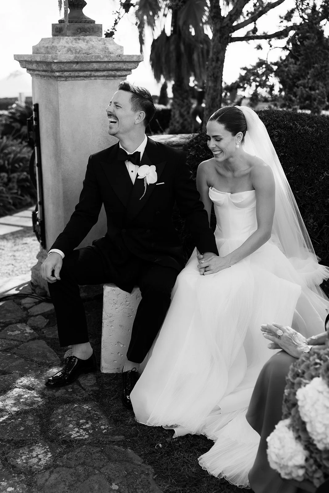 Bride and groom during wedding ceremony with guests in Menorca, Spain