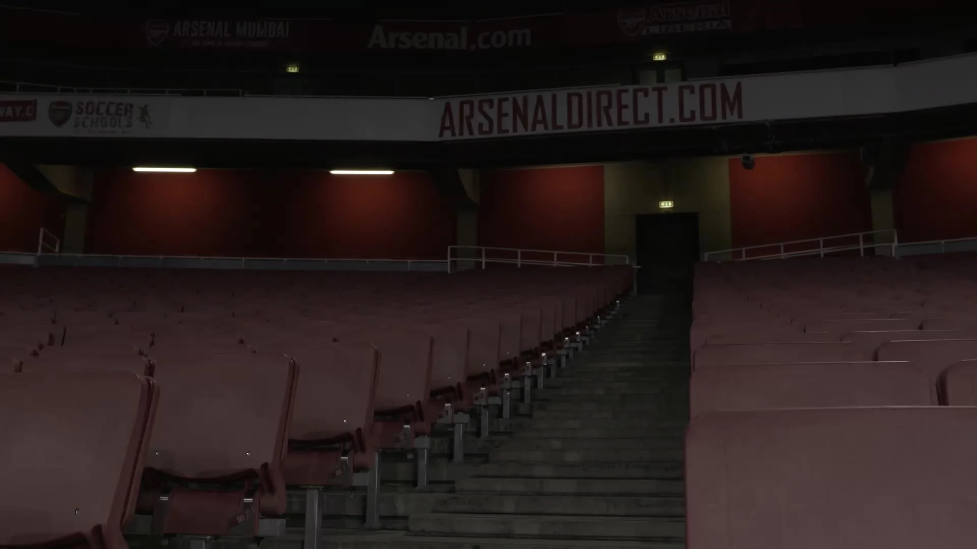 Empty stands at Emirates Stadium after dark