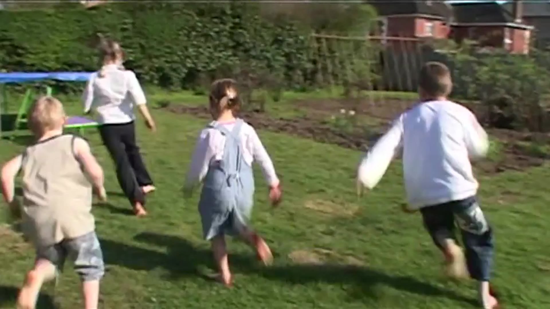 Running in the garden with family