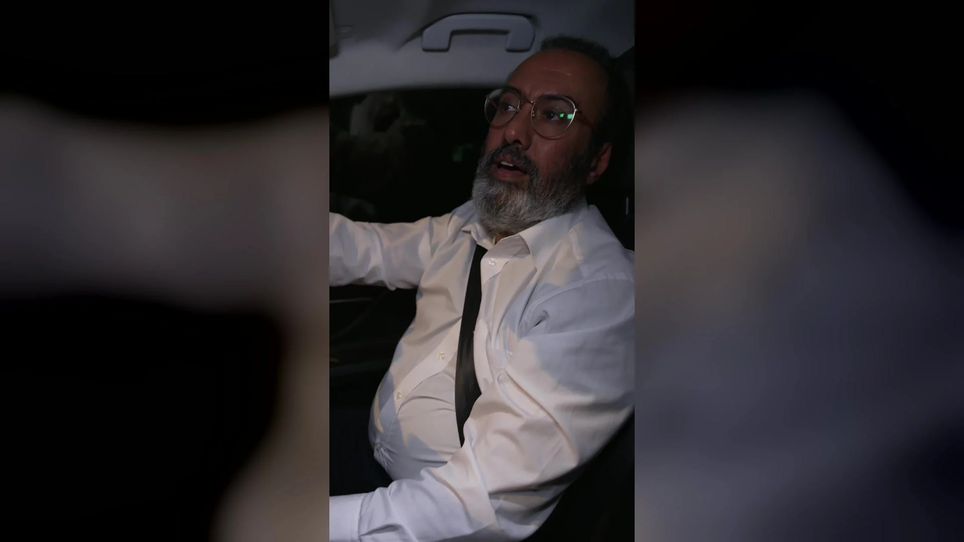 A driver at the wheel at night