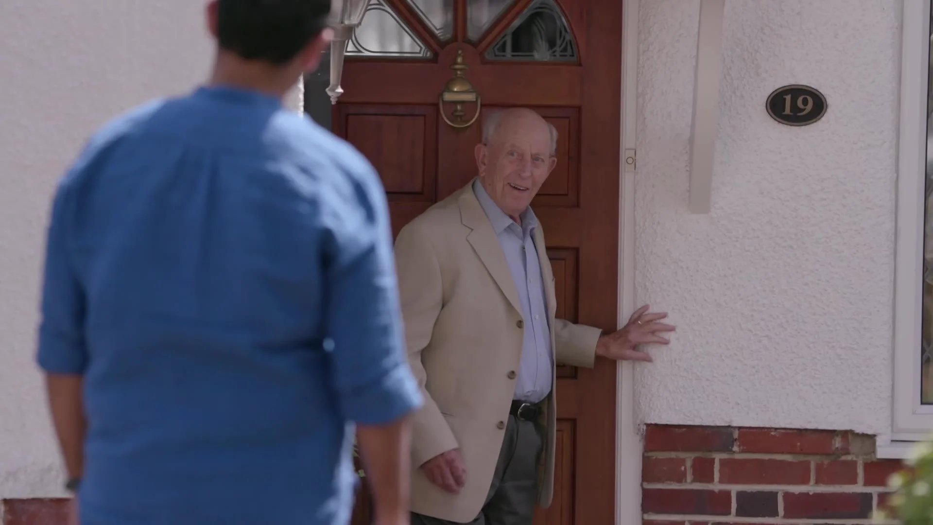 A volunteer driver arriving at the door