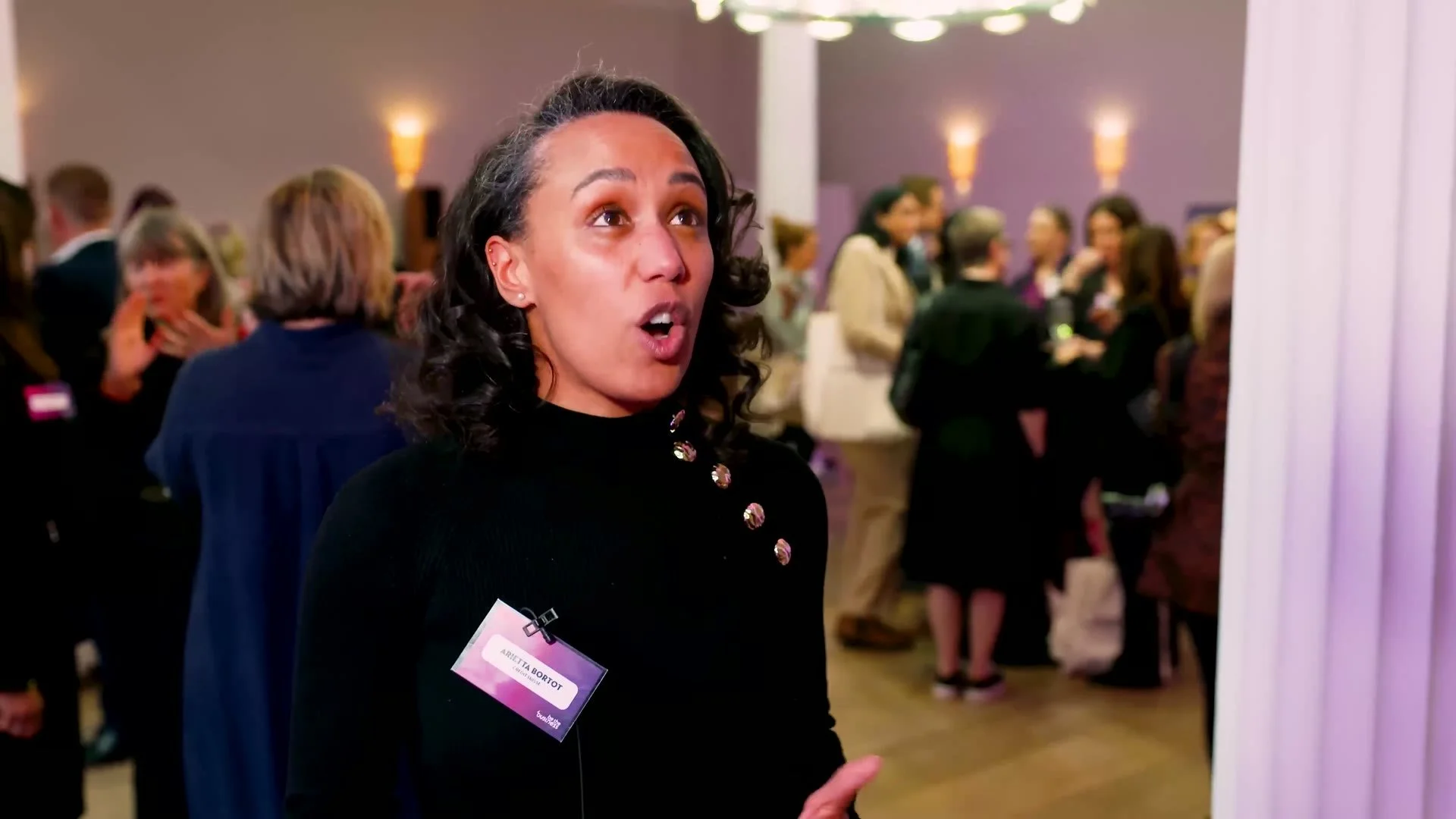 A volunteer board member at the reception